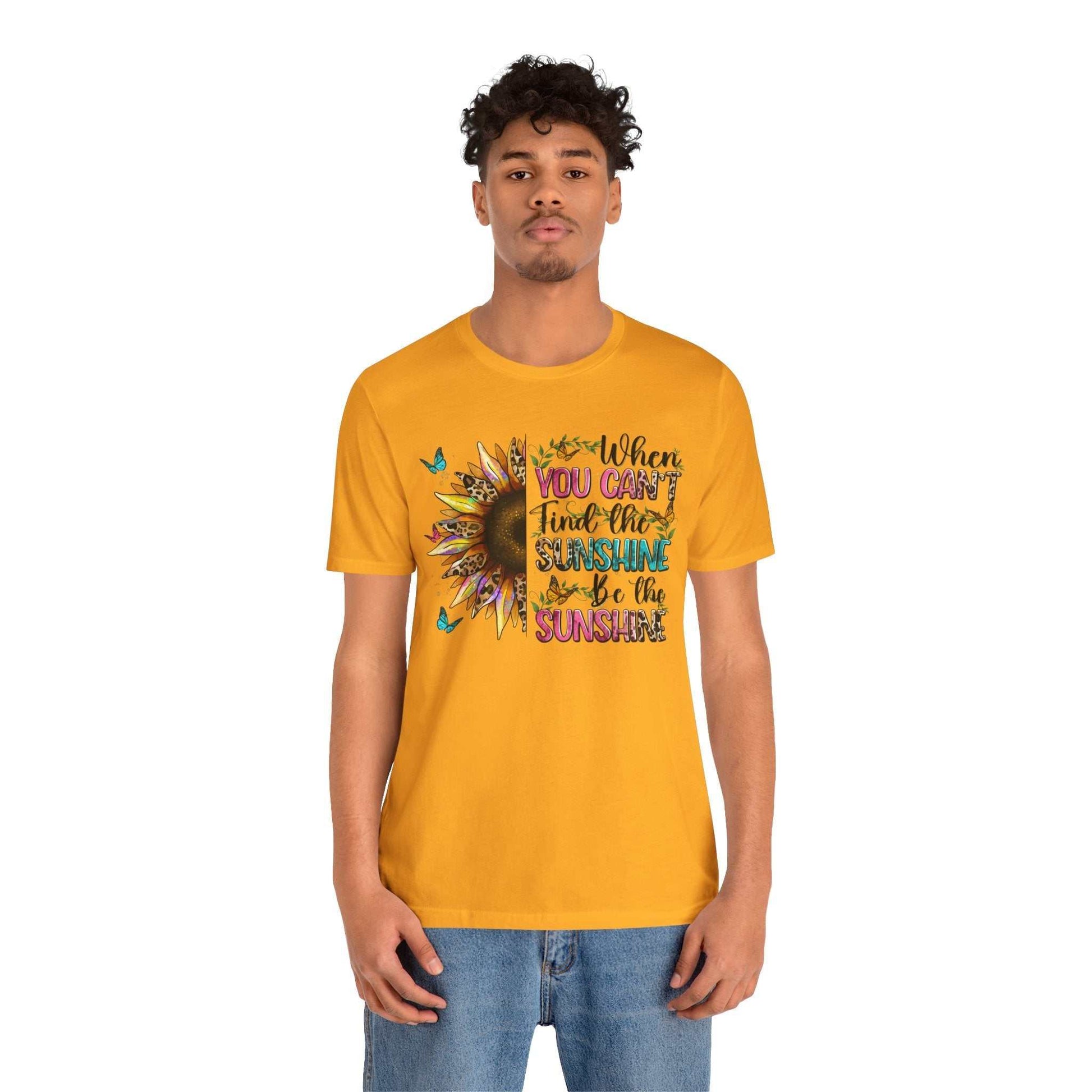 Man wearing bright yellow Sunshine Quote Tee with sunflower and positive quote graphic