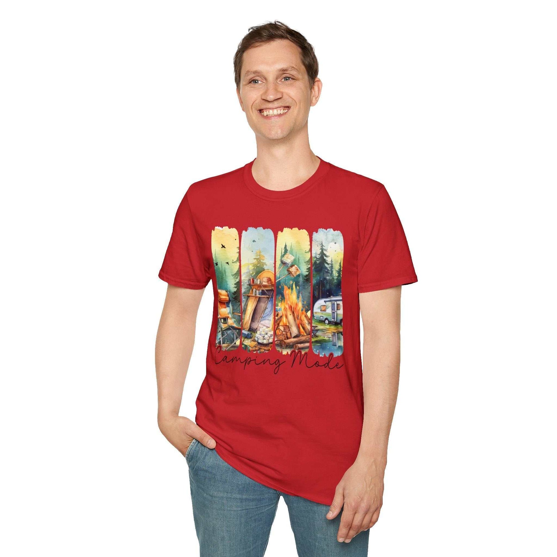 Red unisex t-shirt with camping-themed graphic featuring campfire, tent, and forest scenes, worn by smiling man.