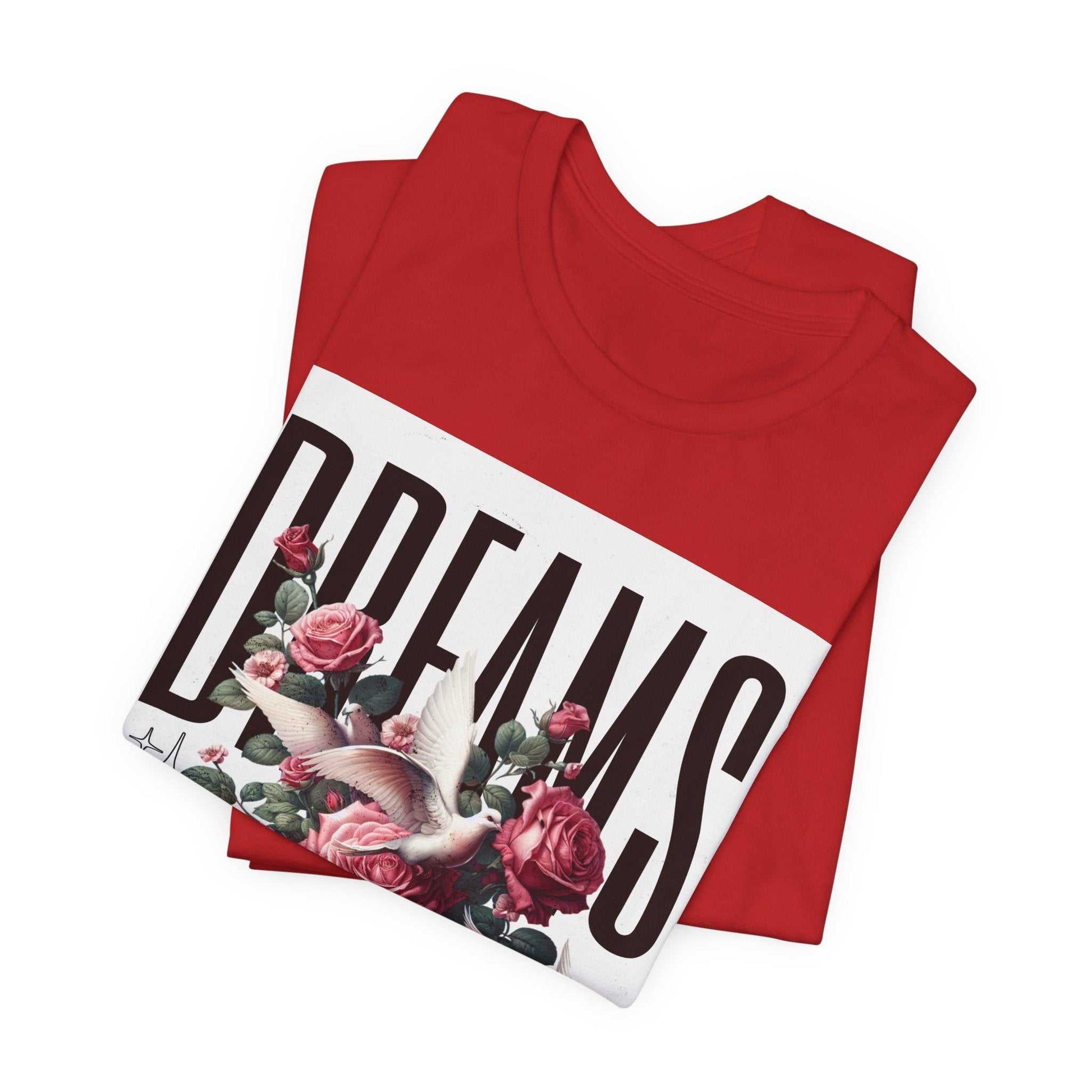 Red Dreams Floral Tee with large typography, roses, and a white bird design, folded flat.
