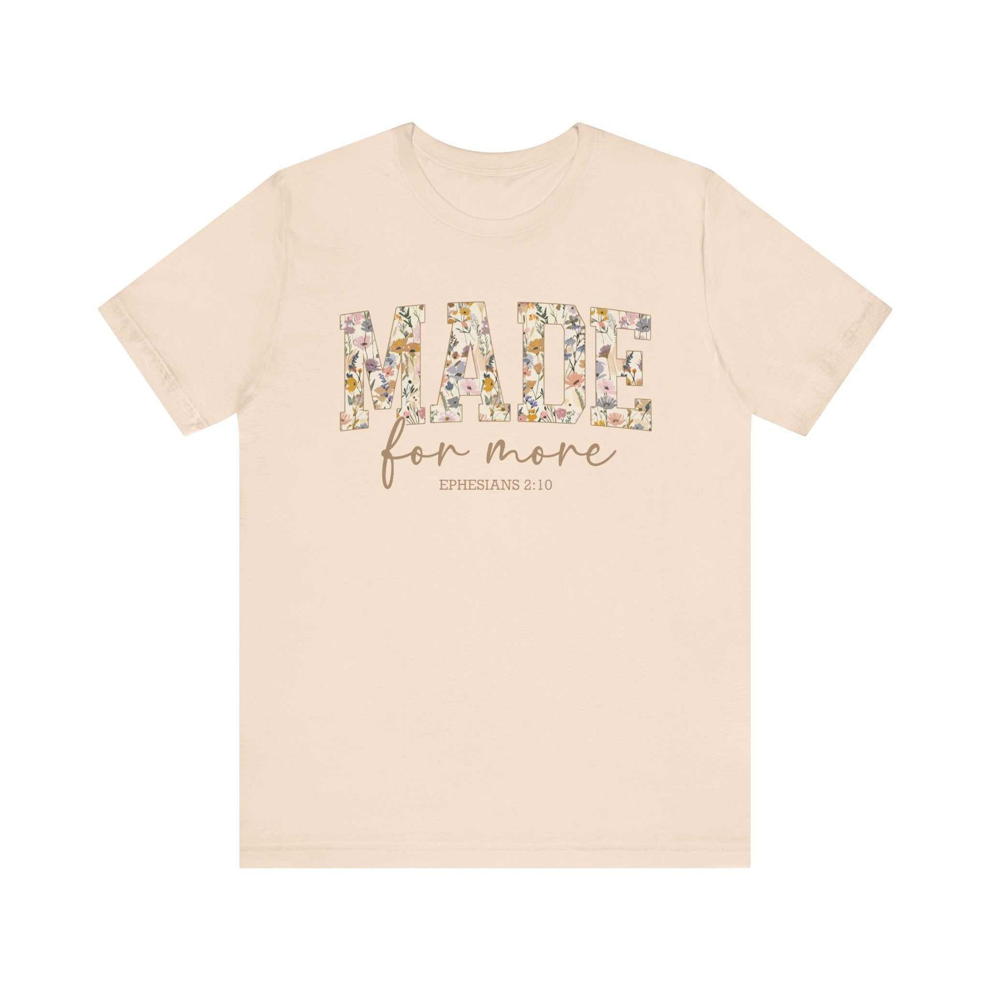 Beige unisex short sleeve t-shirt with "MADE for more EPHESIANS 2:10" floral print design, breathable cotton fabric.