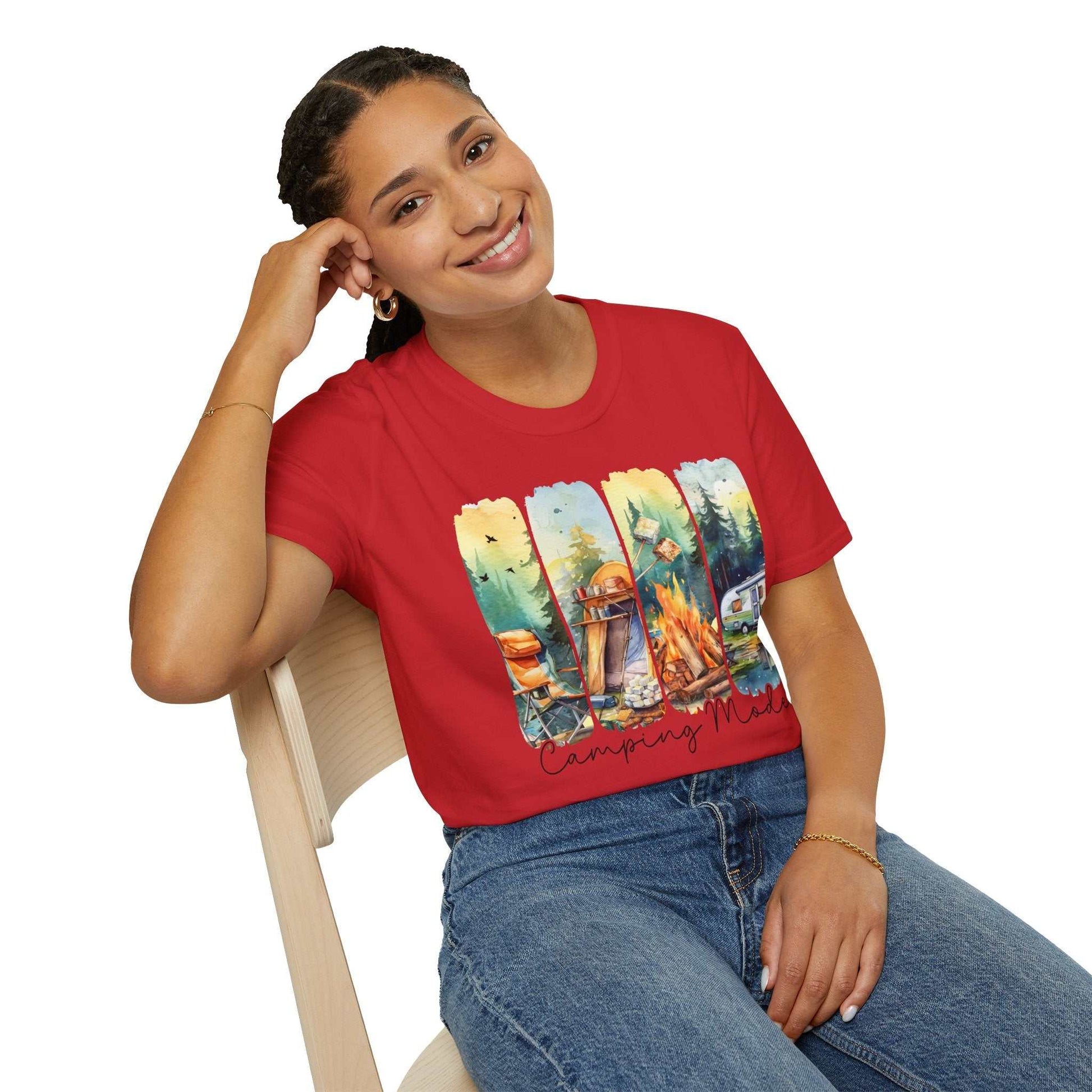 Woman wearing red Camping Adventure unisex t-shirt with outdoor camping design sitting on chair