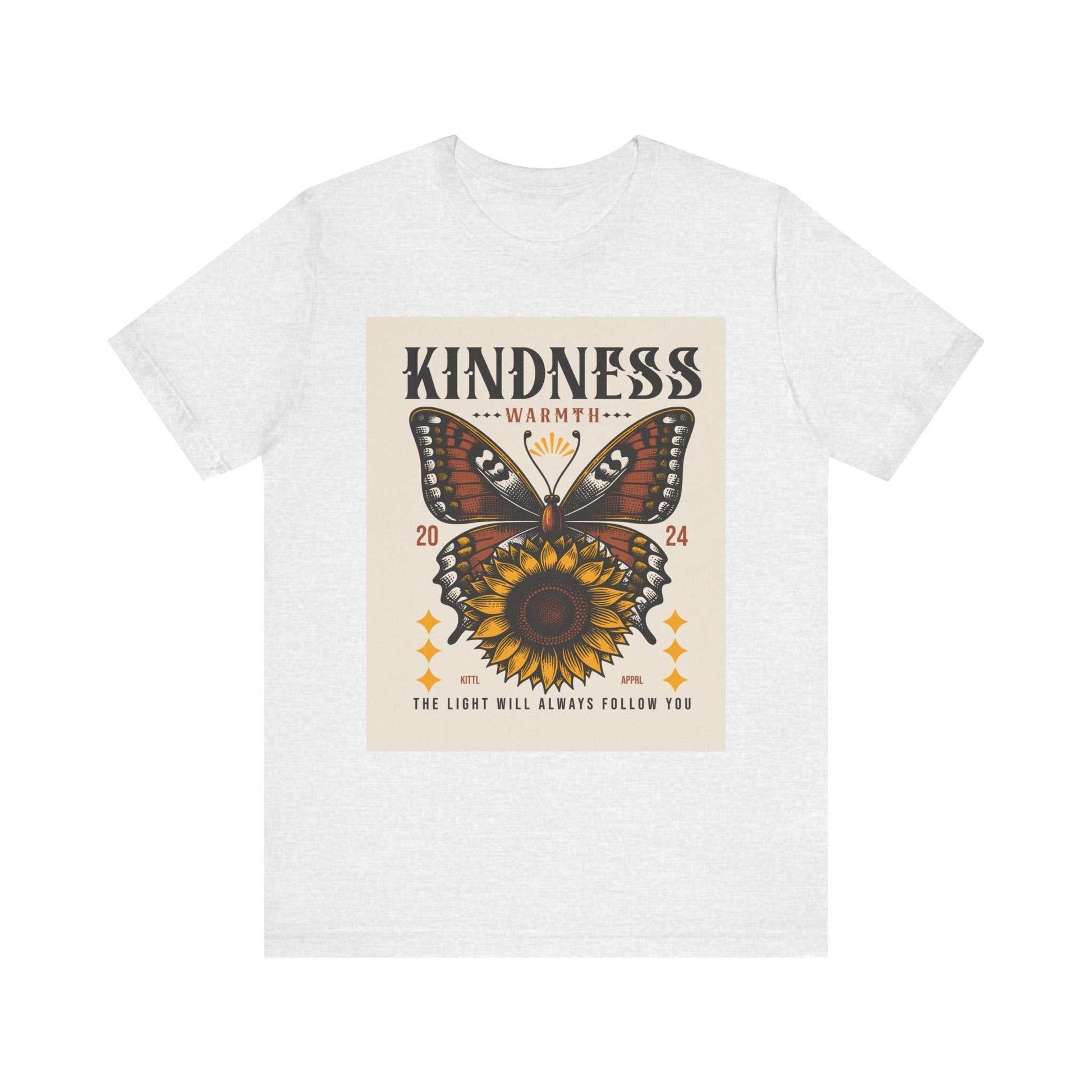 White Kindness Butterfly Tee featuring a butterfly and sunflower design with the text "Kindness Warmth 2024 The Light Will Always Follow You"