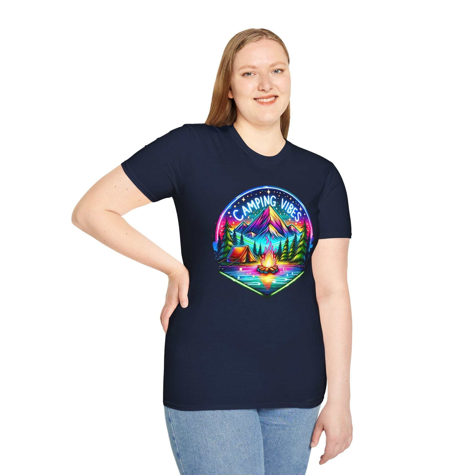 Woman wearing navy Camping Vibes Unisex Softstyle T-Shirt with colorful mountain and campfire design