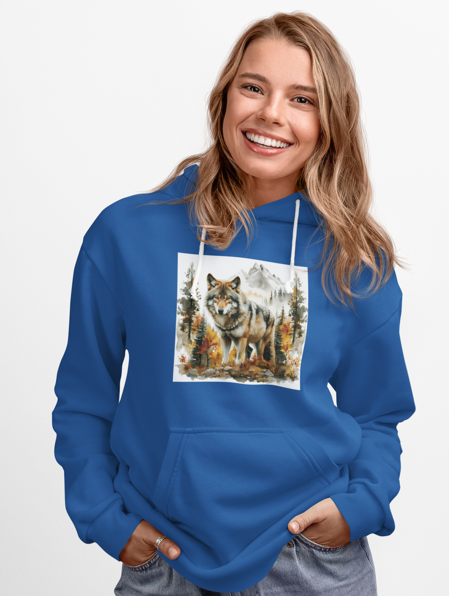 woman wearing blue Wilderness Wolf Hoodie with wolf and mountain design on front pocket hoodie