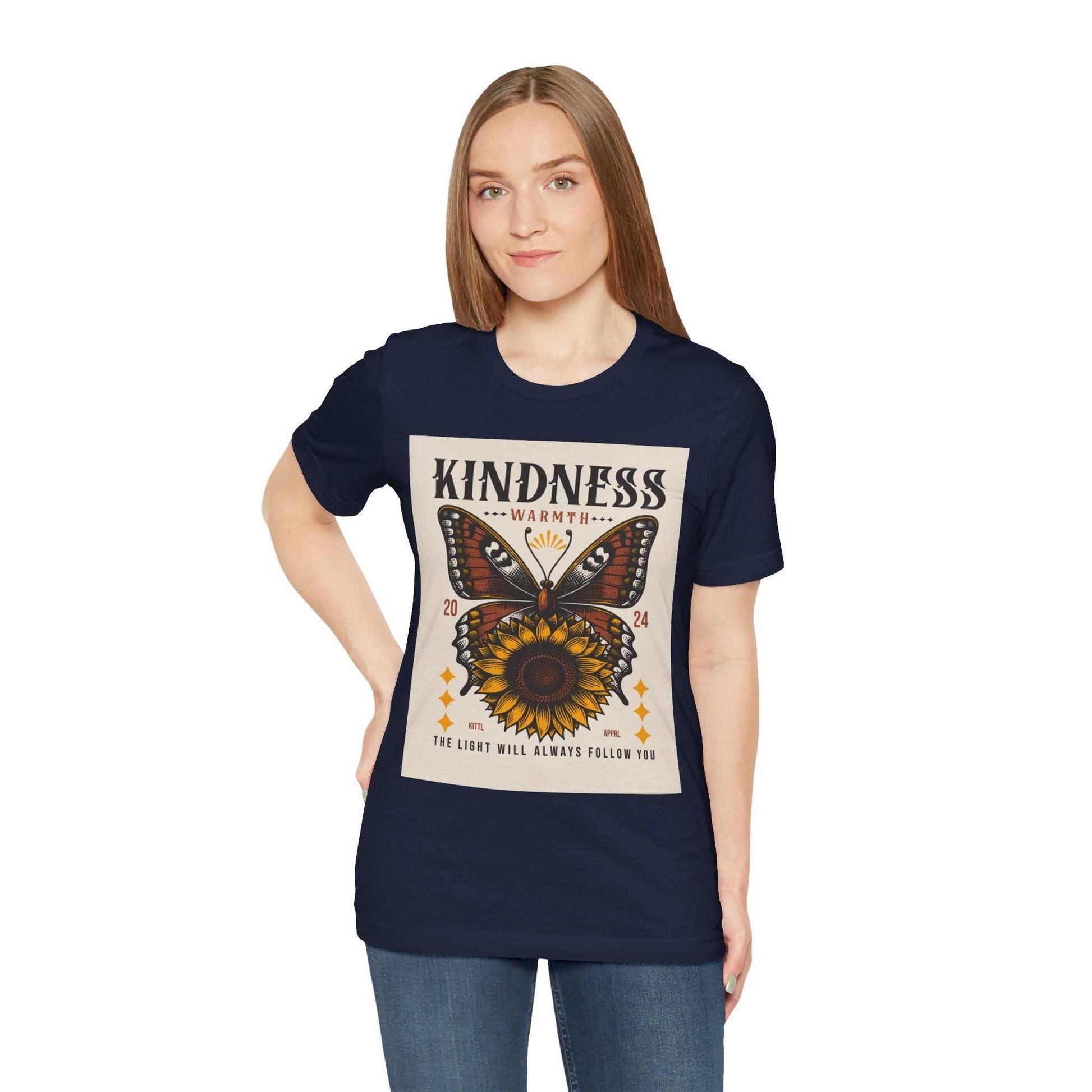 Woman wearing navy Kindness Butterfly Tee with butterfly and sunflower design and positive kindness message