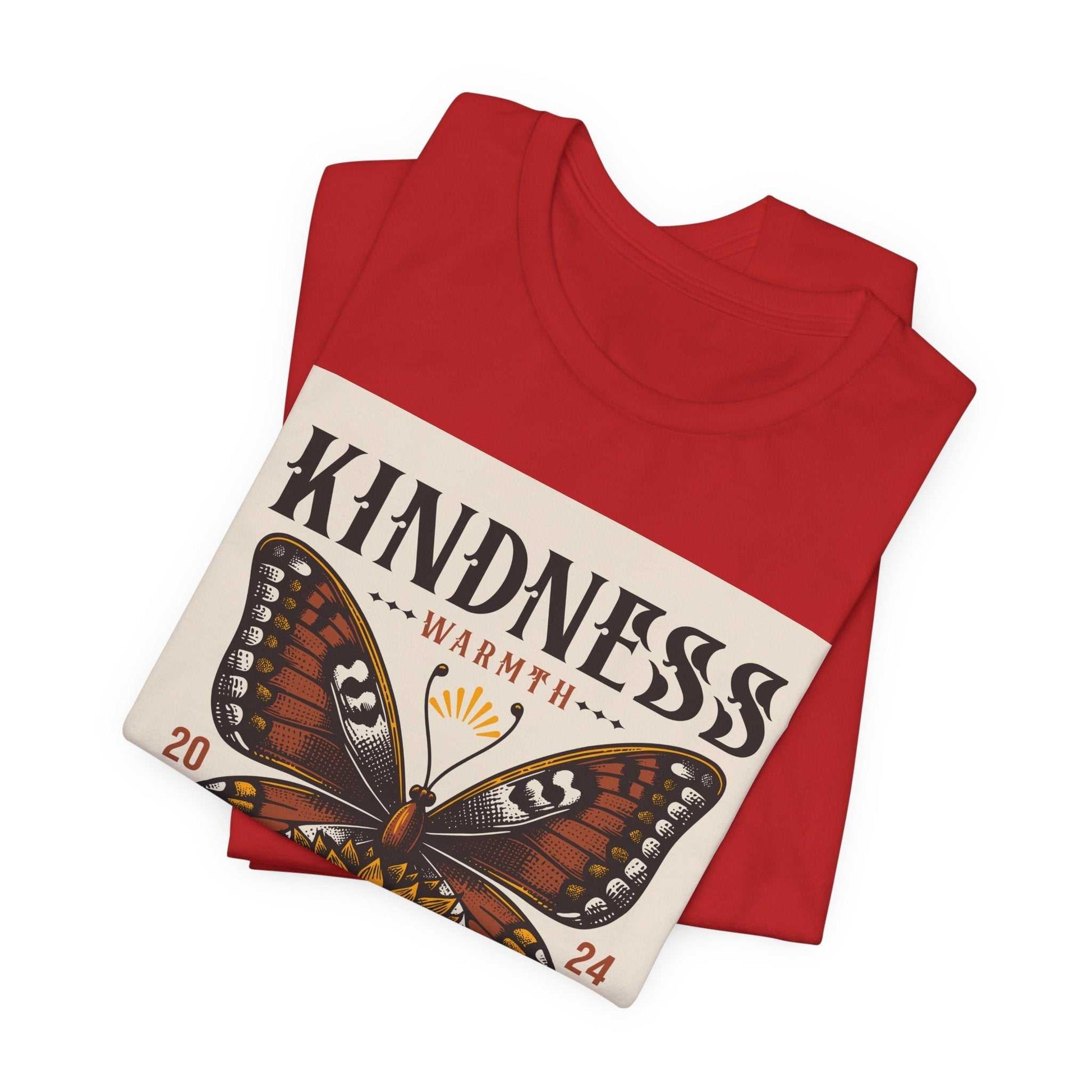 Red "Kindness Butterfly Tee" with a brown butterfly graphic and the word "Kindness" printed on the front