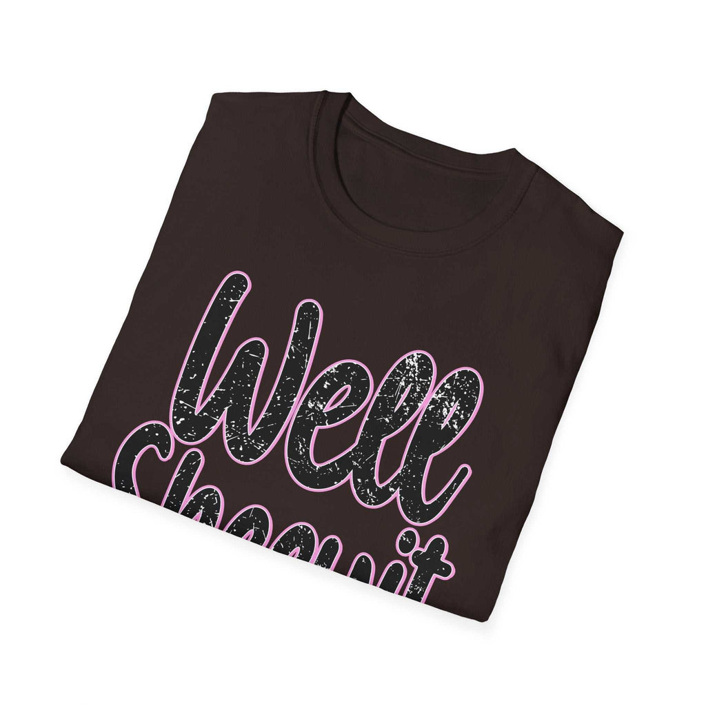 Black casual statement tee with "Well Sheeyit" funny quote in textured pink and white lettering, folded style.