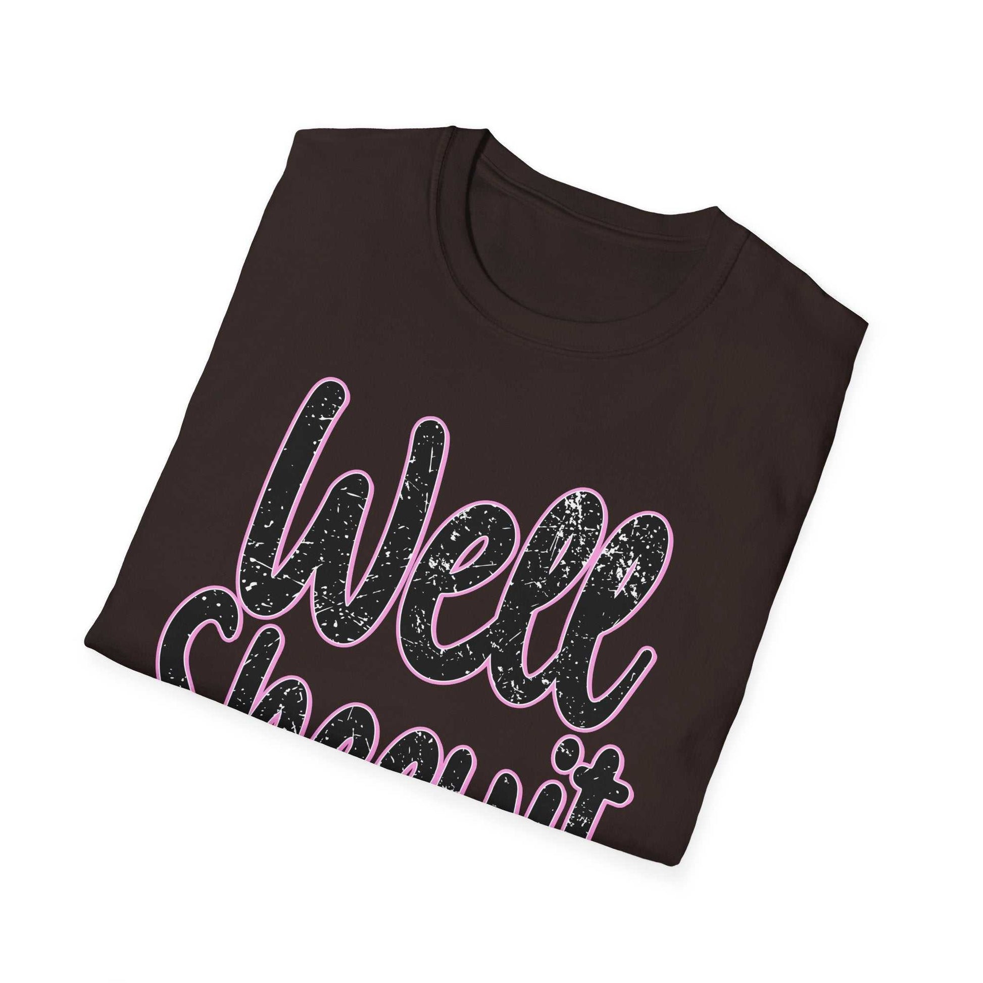 Black casual statement tee with "Well Sheeyit" funny quote in textured pink and white lettering, folded style.