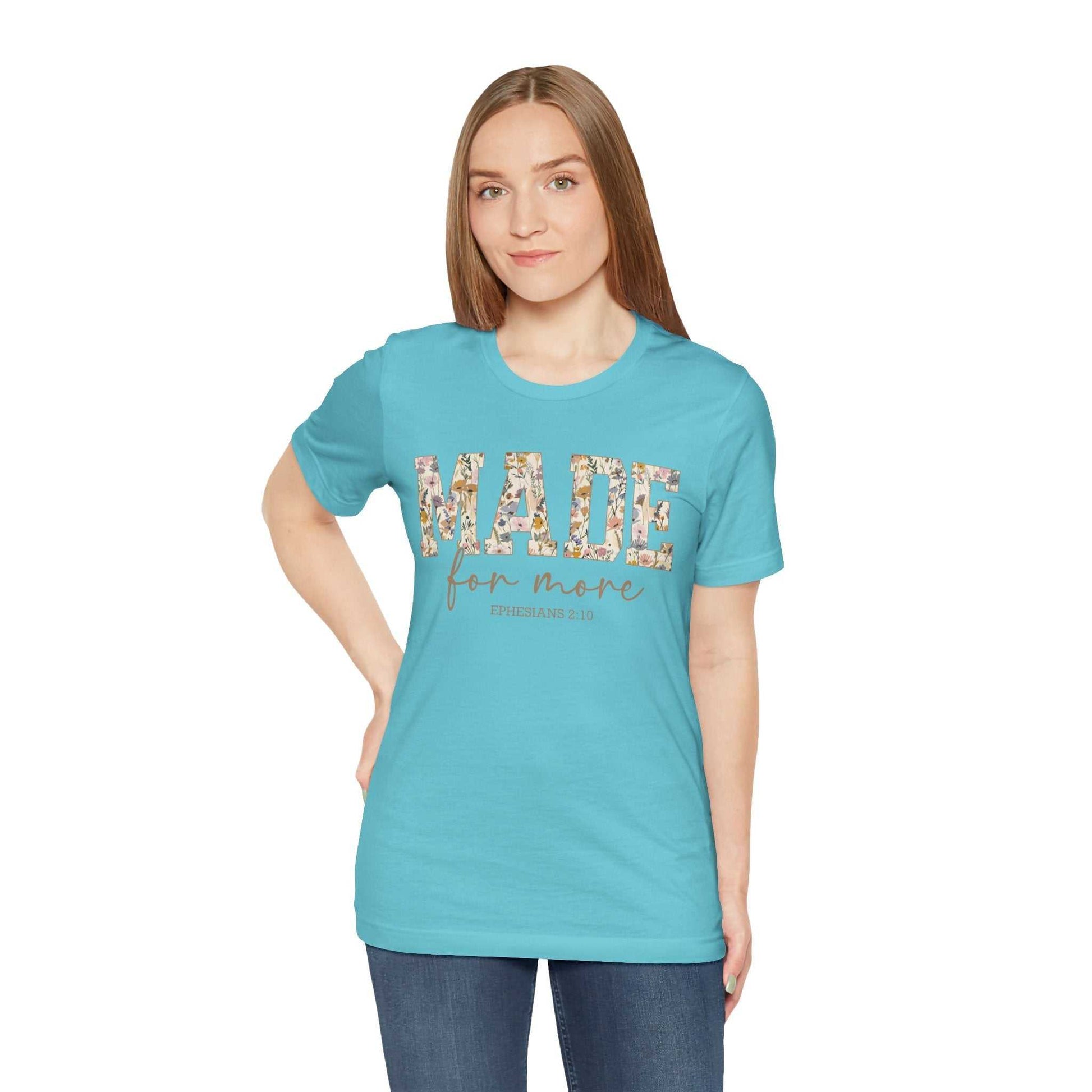 Woman wearing blue "Made for More" floral print unisex jersey short sleeve tee