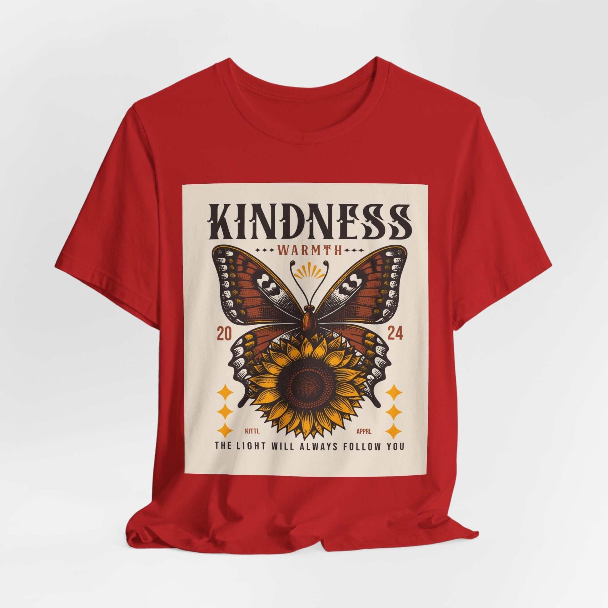 Red Kindness Butterfly Tee featuring a butterfly and sunflower design with the text "The light will always follow you"
