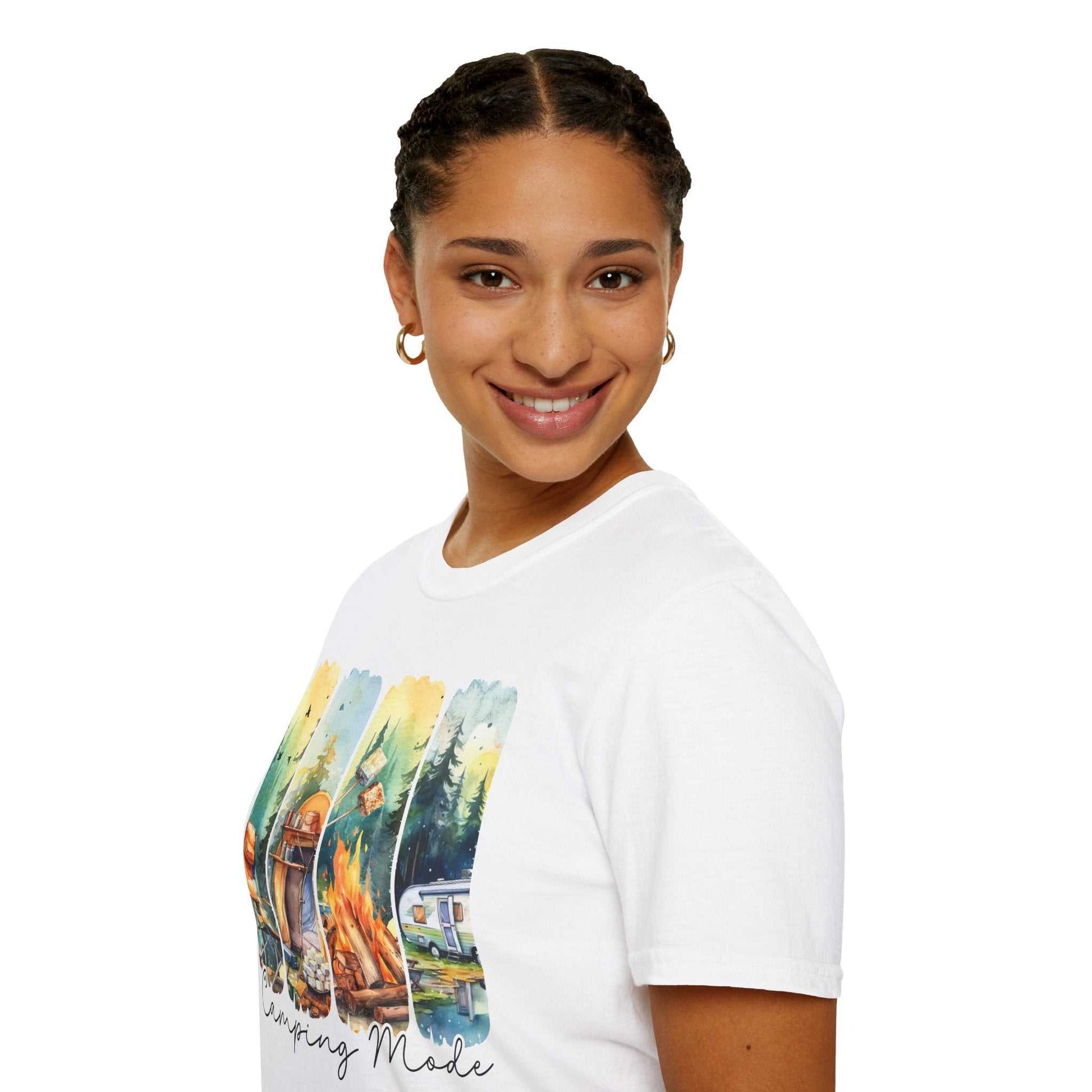 Woman wearing a white Camping Adventure Unisex T-Shirt with colorful camping-themed graphic design