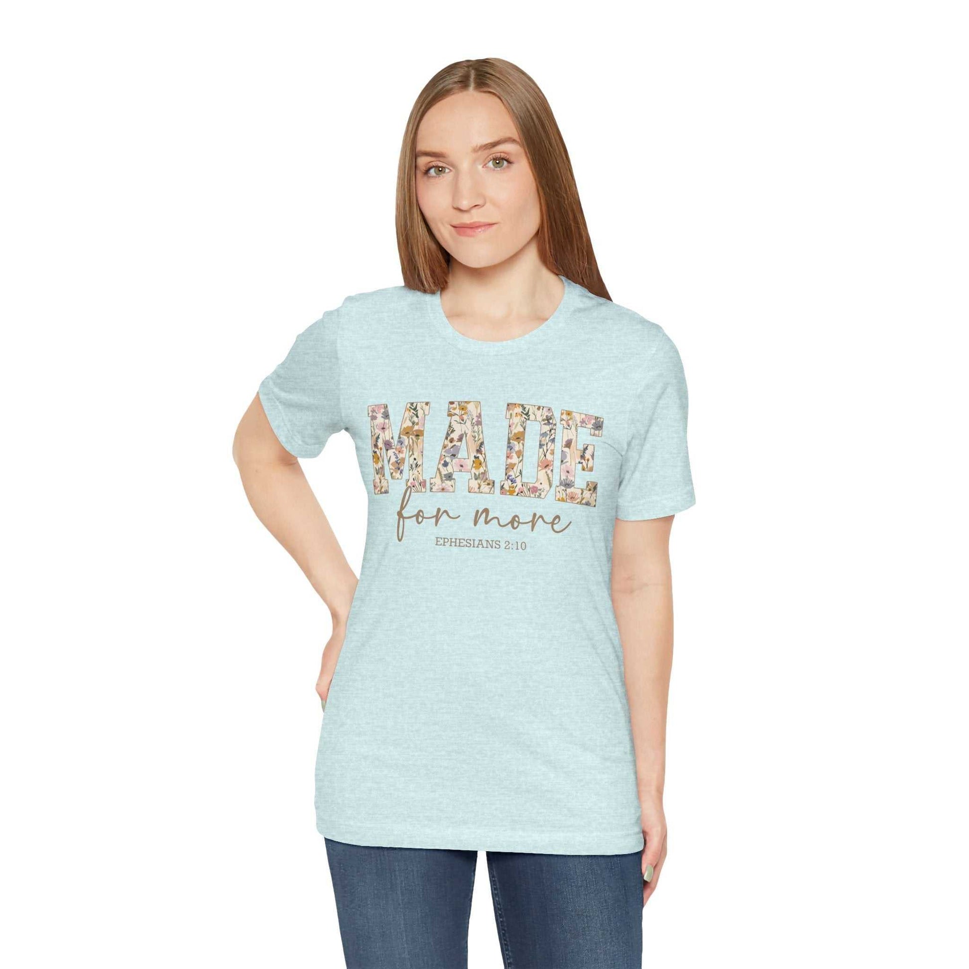 Woman wearing light blue Made for More Tee with floral text design, casual fit unisex jersey short sleeve cotton shirt