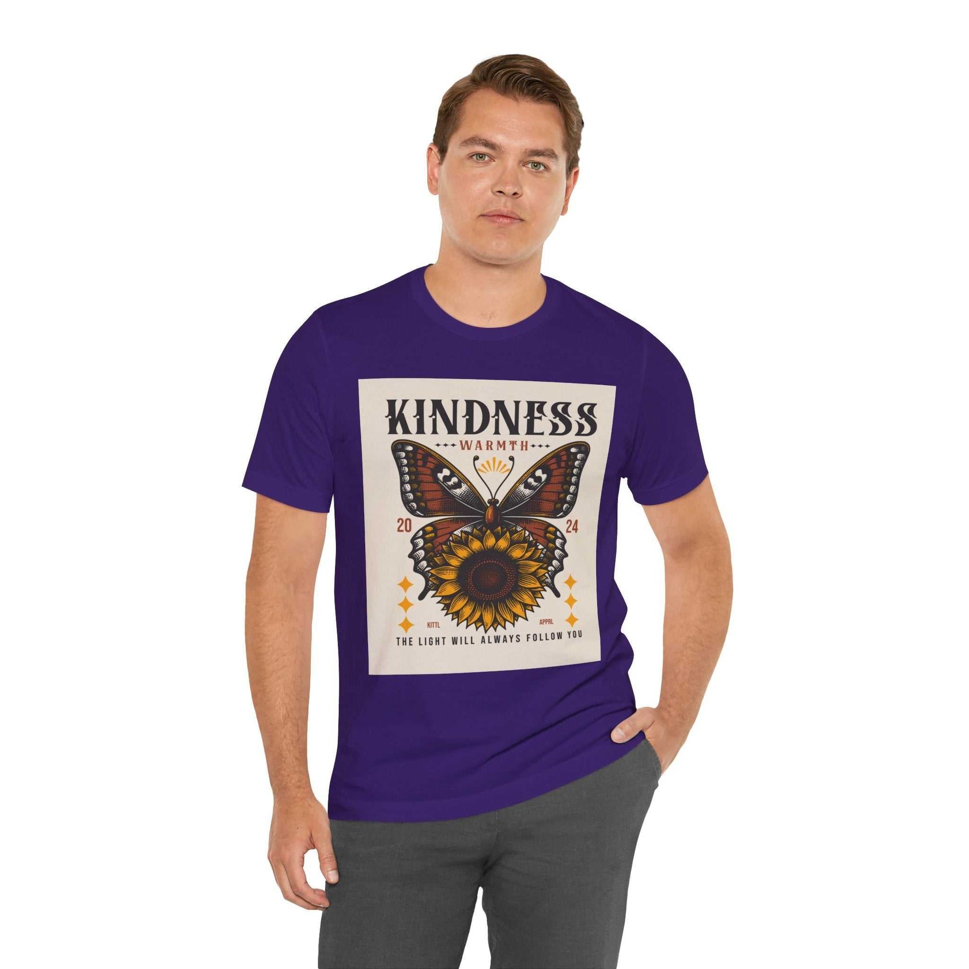Man wearing a purple Kindness Butterfly Tee with butterfly and sunflower design promoting positivity and kindness