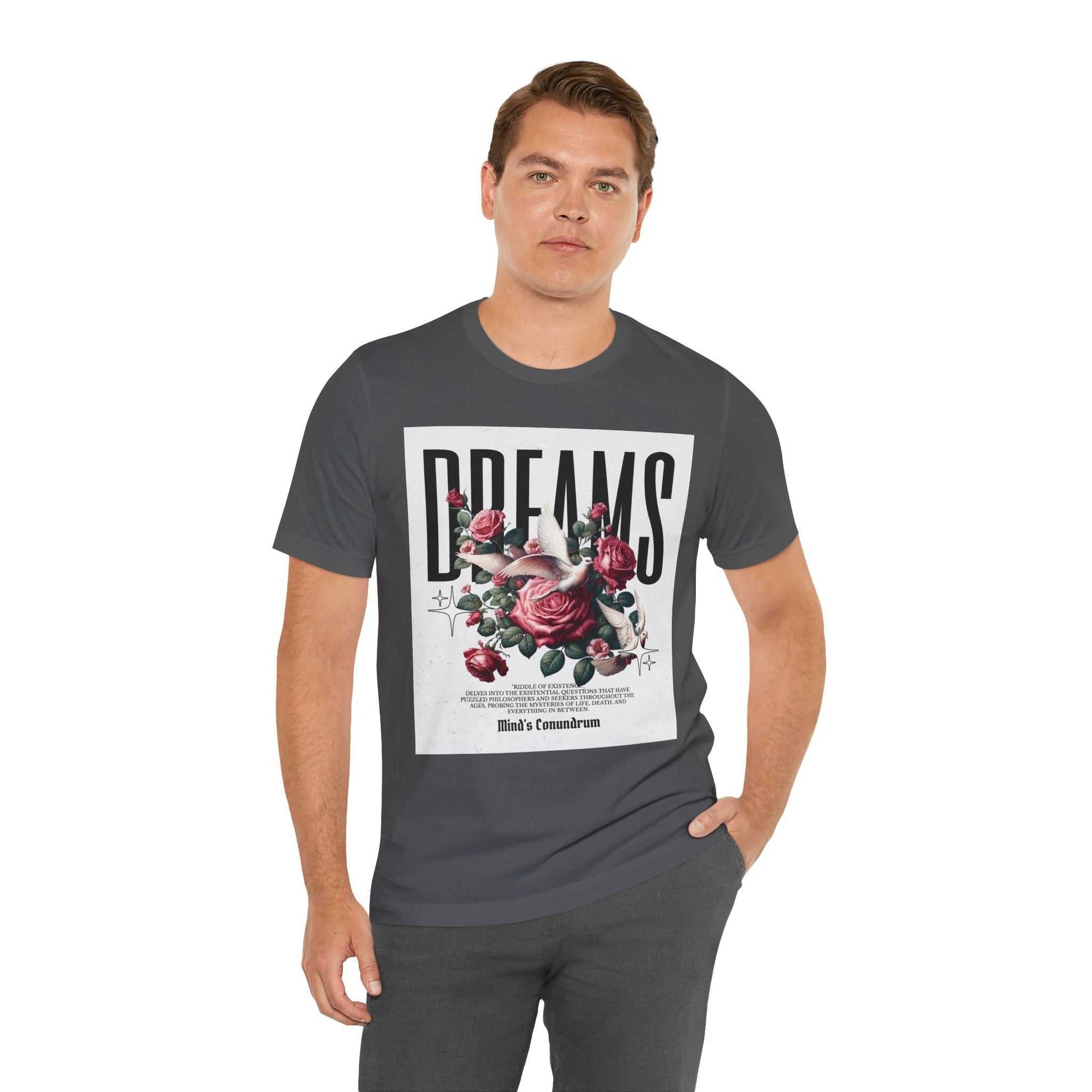 Man wearing a dark Dreams Floral Tee with a large floral graphic and bold "DREAMS" text on the front