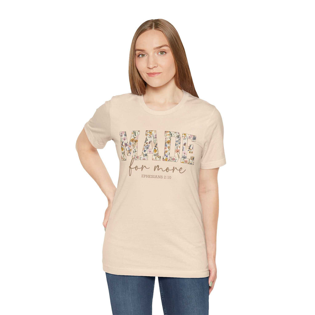 Woman wearing beige Made for More Tee with floral text design and casual fit