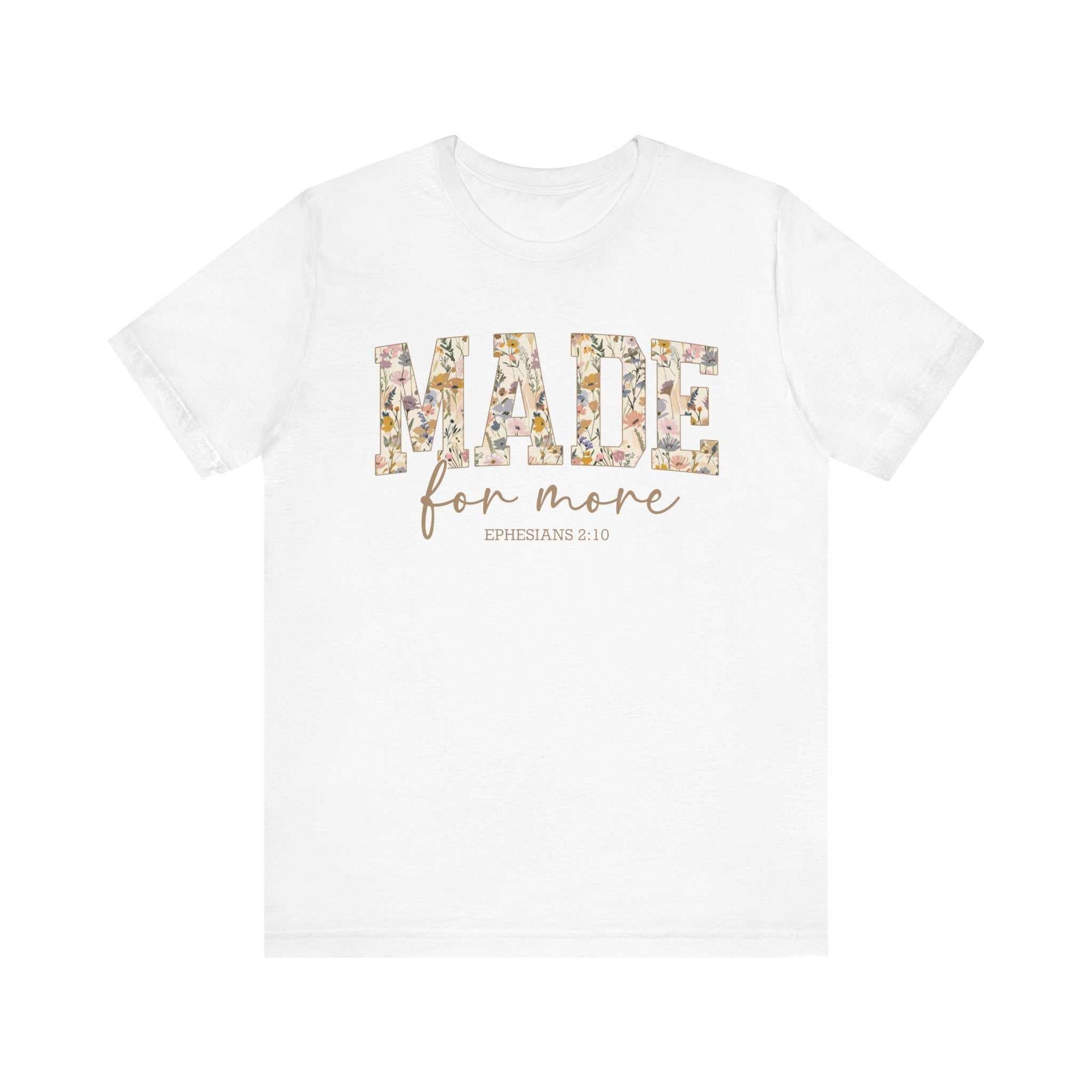 White Made for More Tee with floral patterned "MADE" text and cursive "for more" script, unisex short sleeve cotton shirt