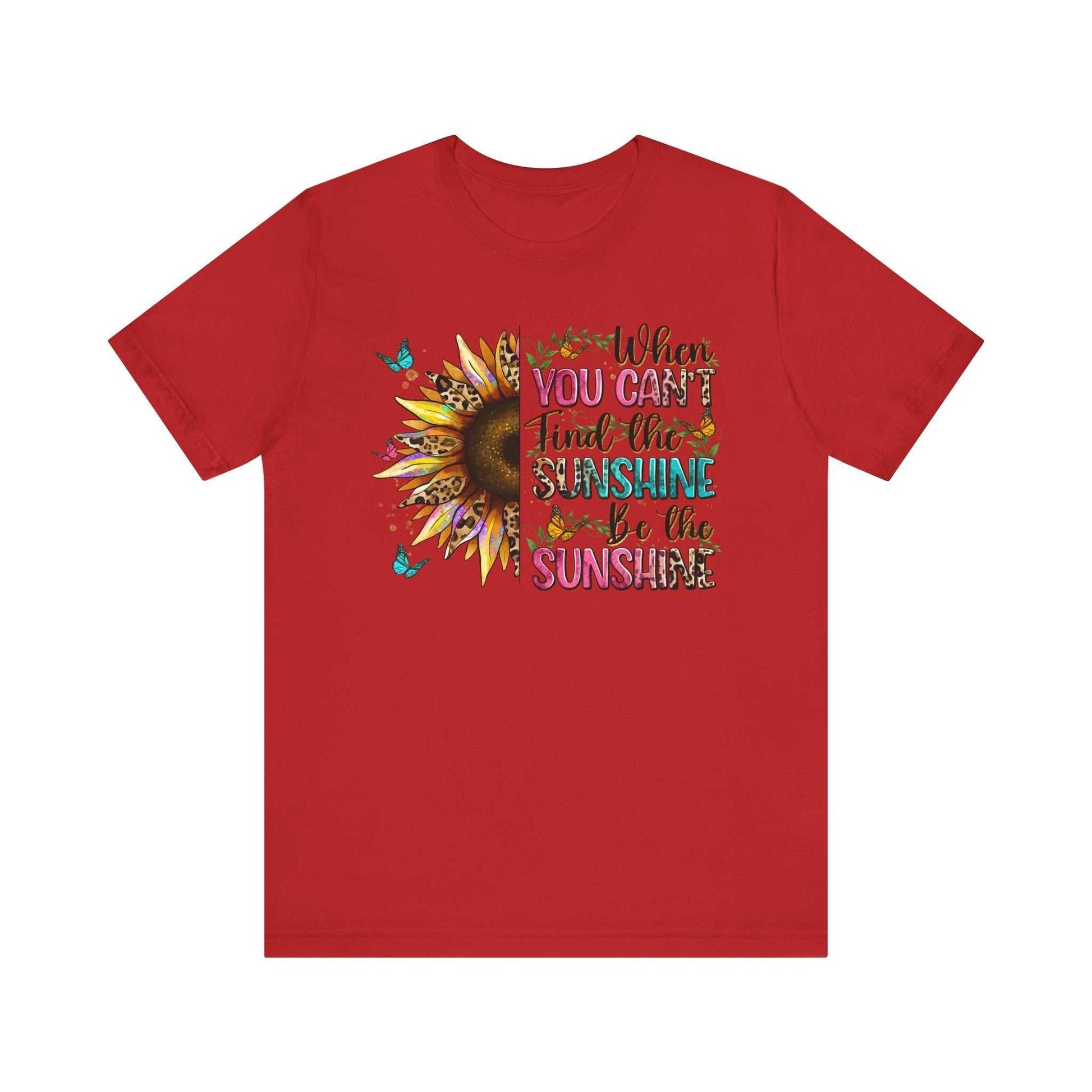 Red Sunshine Quote Tee with sunflower and motivational text "When you can't find the sunshine be the sunshine" design
