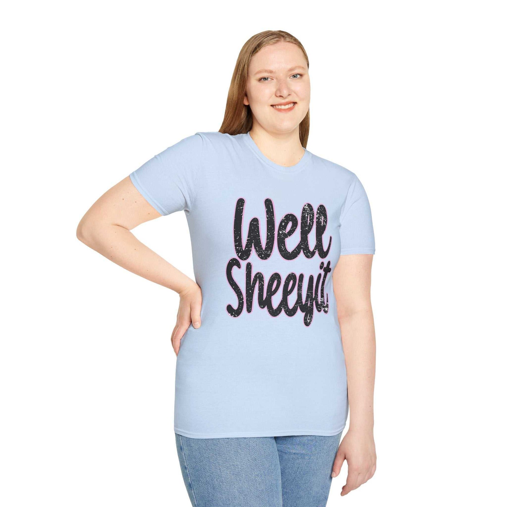 Woman wearing light blue casual statement tee with "Well Sheeyit" funny quote in black text