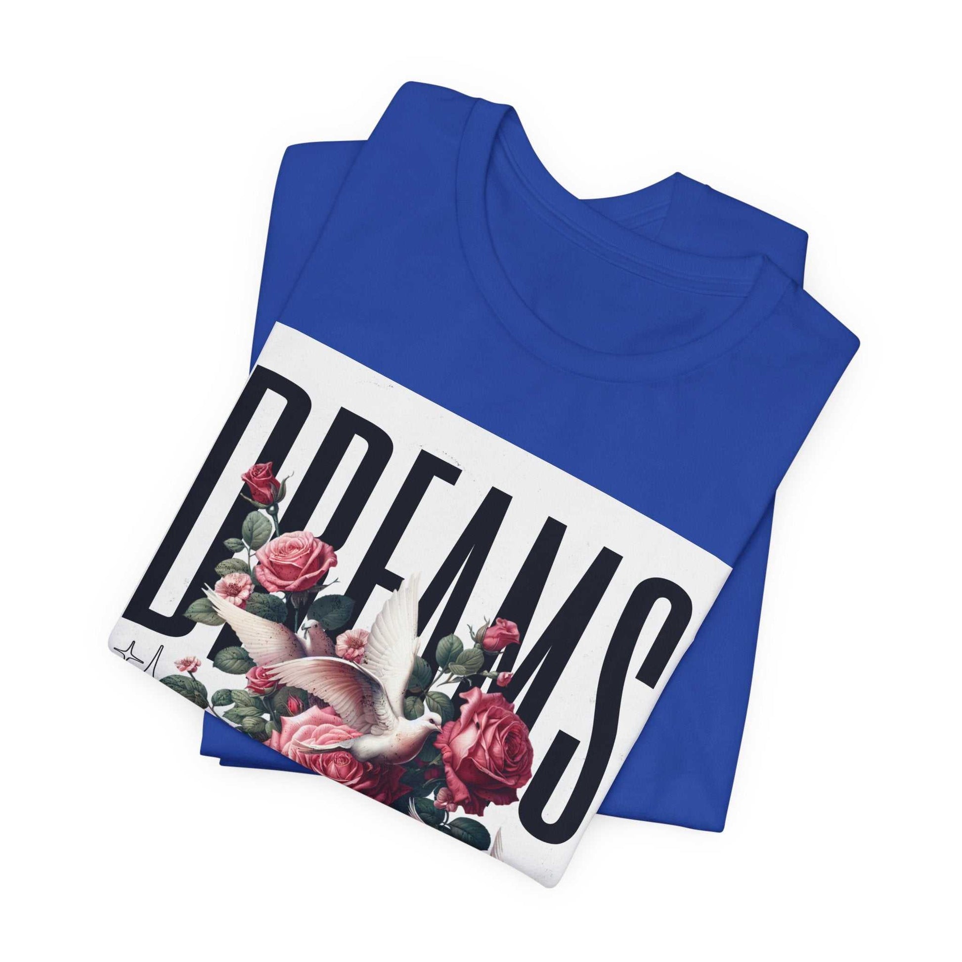 Blue Dreams Floral Tee with bird and pink roses graphic design, folded unisex short sleeve shirt