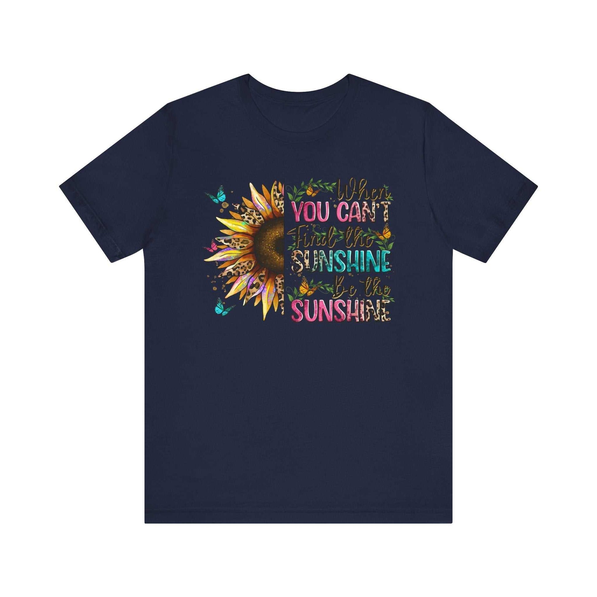 Navy unisex Sunshine Quote Tee with vibrant sunflower and colorful motivational text design.