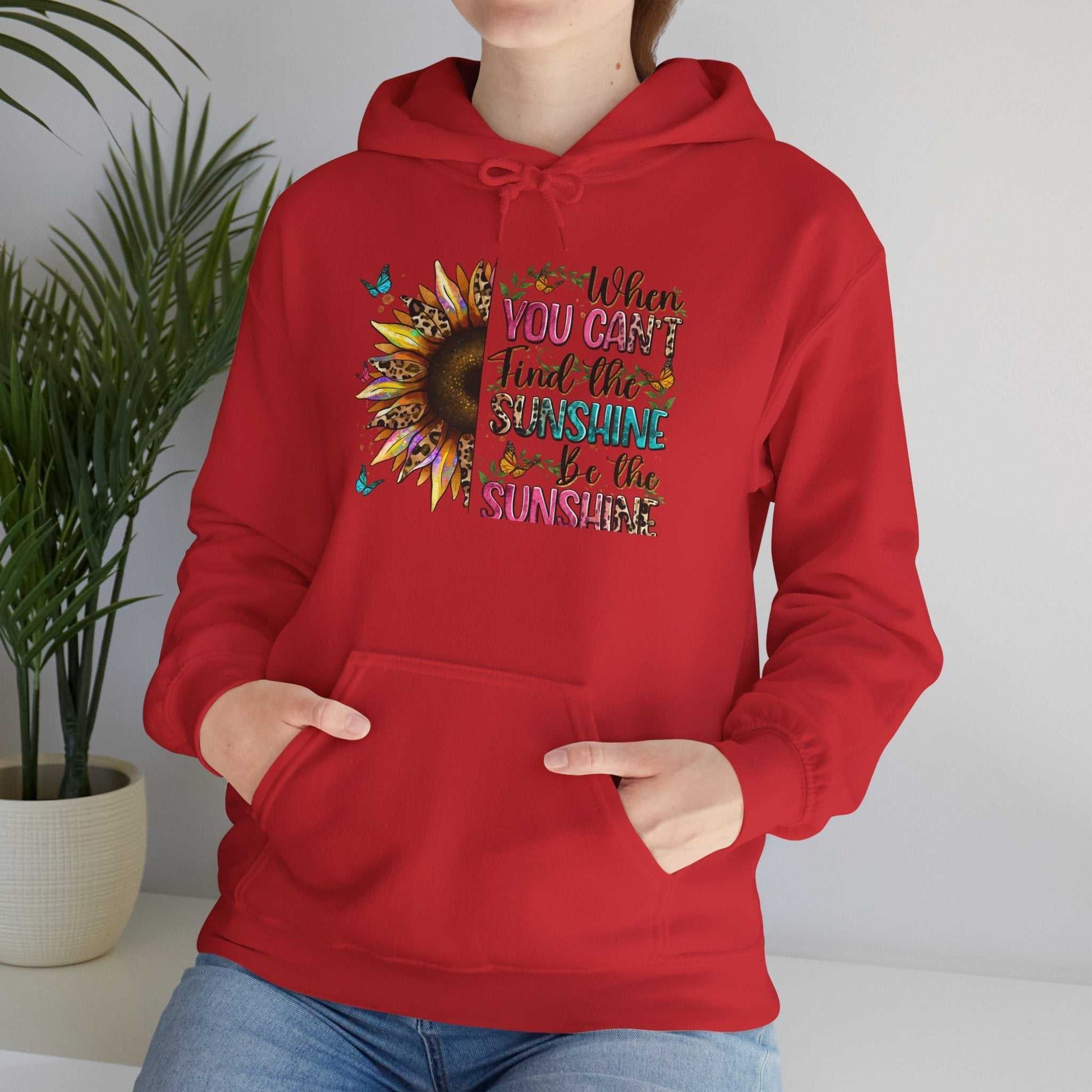 Red sunflower quote hoodie with inspirational text and kangaroo pocket, cozy unisex sweatshirt design
