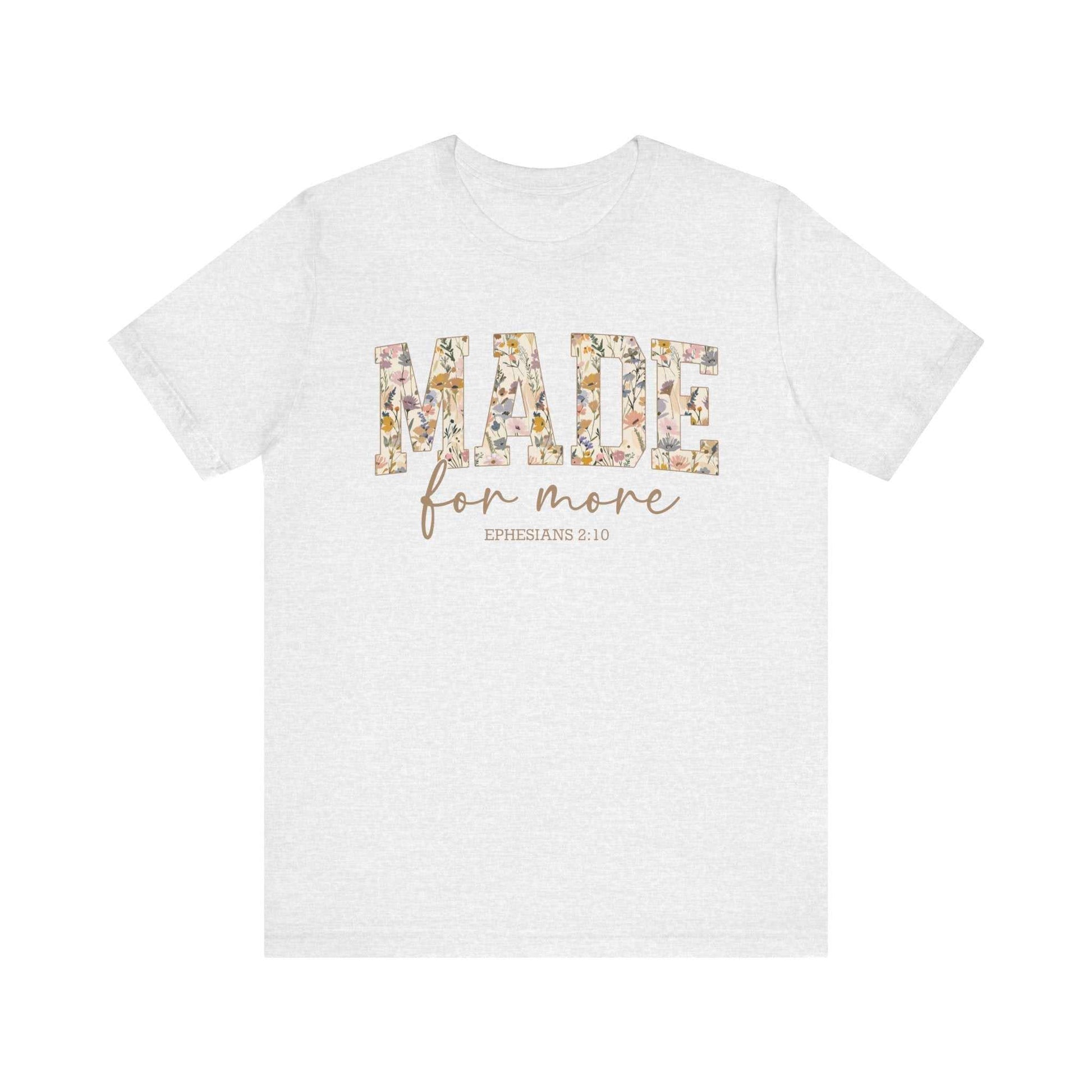 White unisex short sleeve tee with floral patterned "MADE" text and "for more" script below referencing Ephesians 2:10.