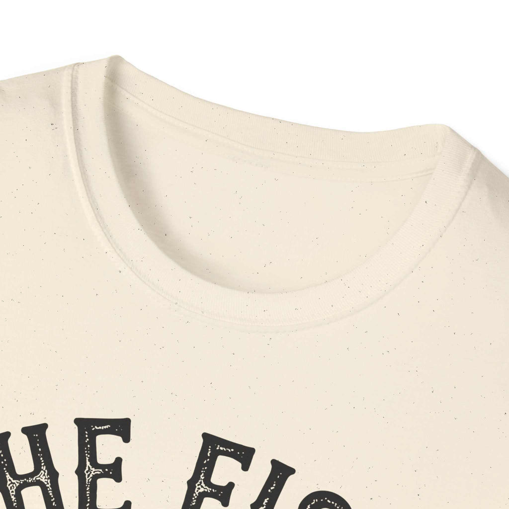 Close-up of cream-colored unisex softstyle t-shirt featuring "The Fish Whisperer" text design