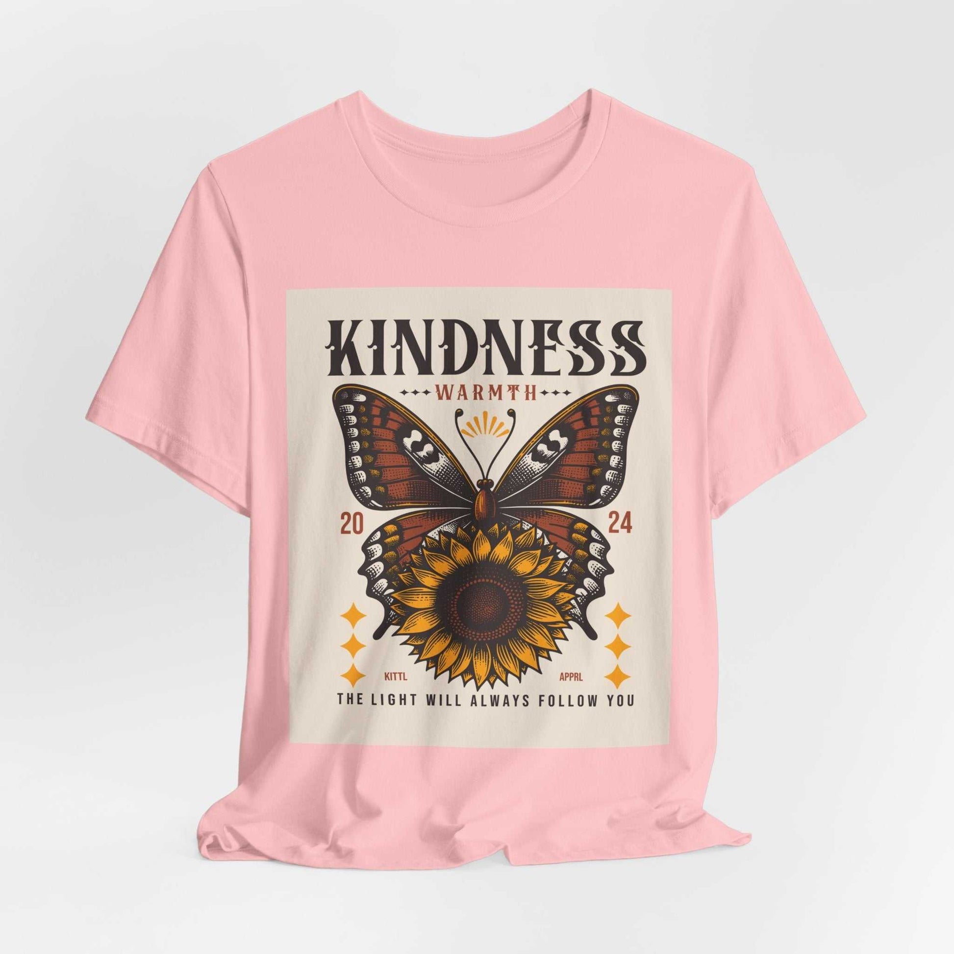 Pink Kindness Butterfly Tee with sunflower and butterfly graphic and motivational text "The light will always follow you"