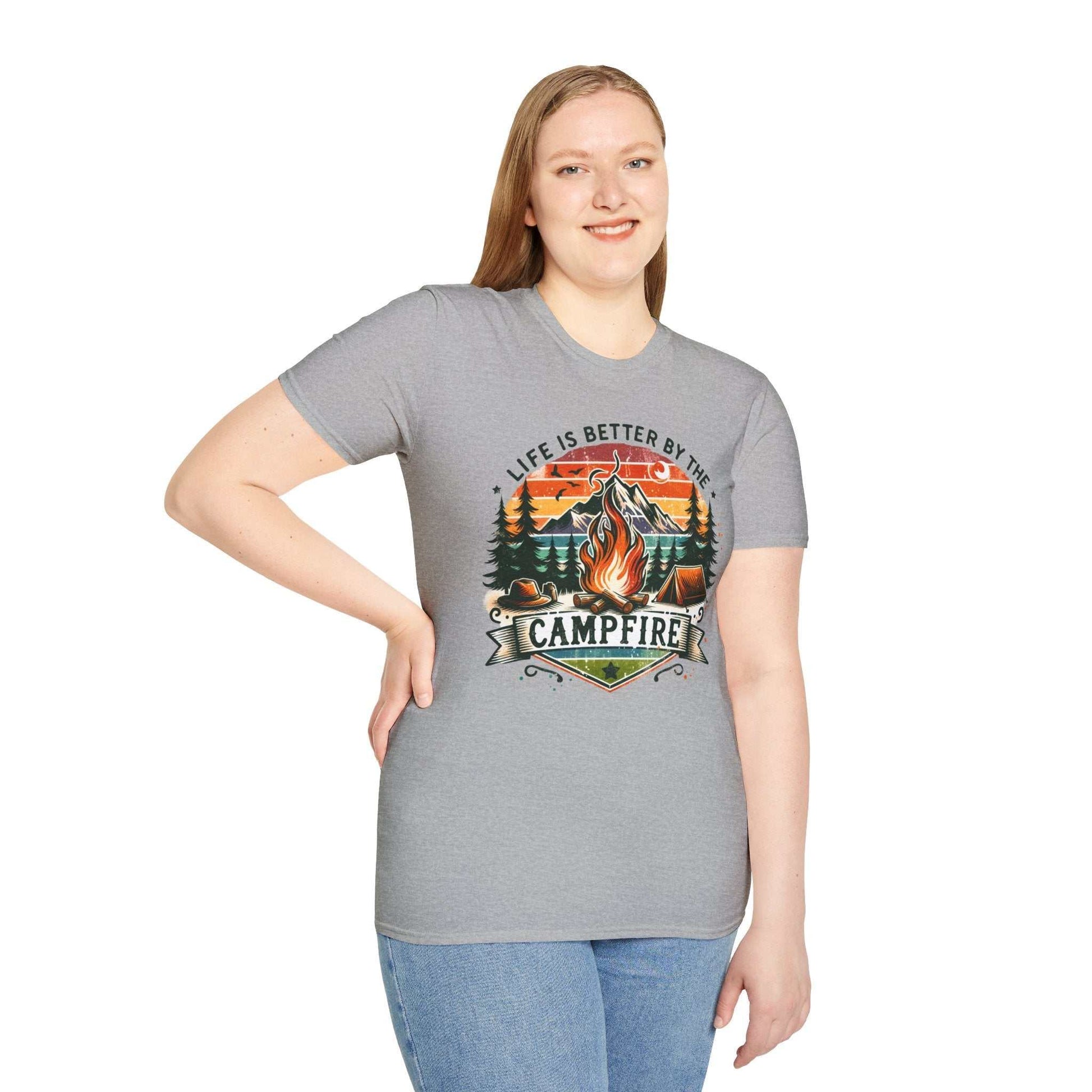 Camping Adventure Unisex T-Shirt in gray with campfire graphic and "Life is Better by the Campfire" text, worn by smiling woman
