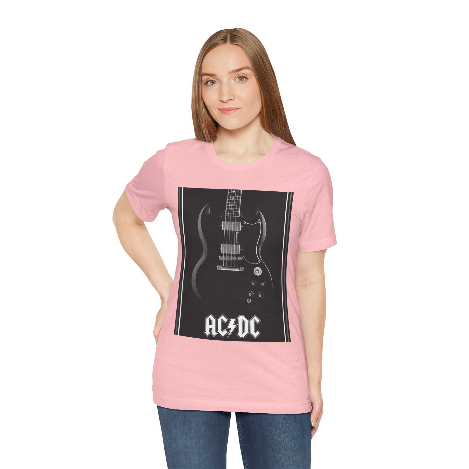 Woman wearing pink rock guitar graphic tee with AC/DC design and black electric guitar print