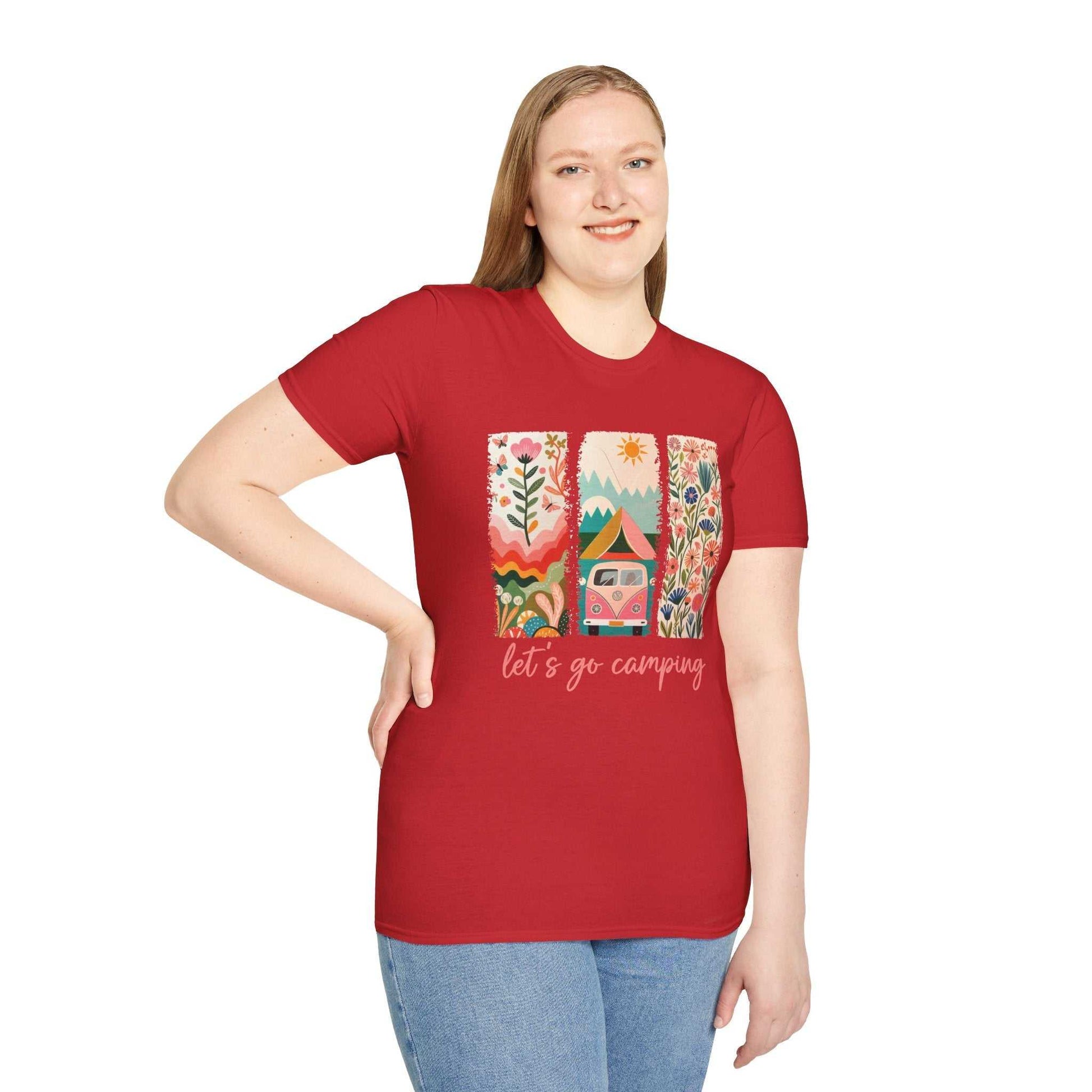 Woman wearing red unisex softstyle t-shirt with colorful camping adventure design and "let's go camping" text