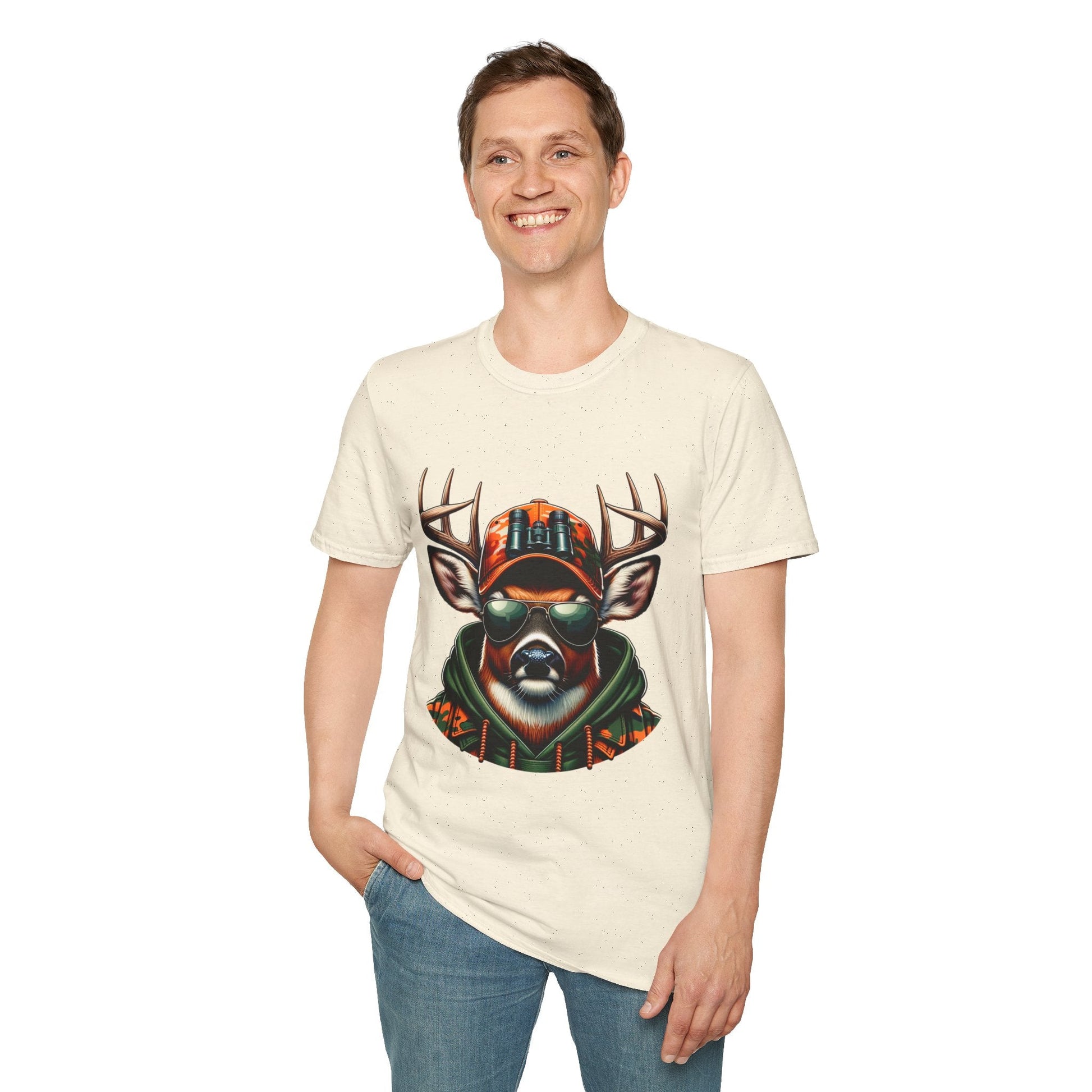 Man wearing a cream hunting enthusiast t-shirt featuring a cool deer with sunglasses and a cap graphic design