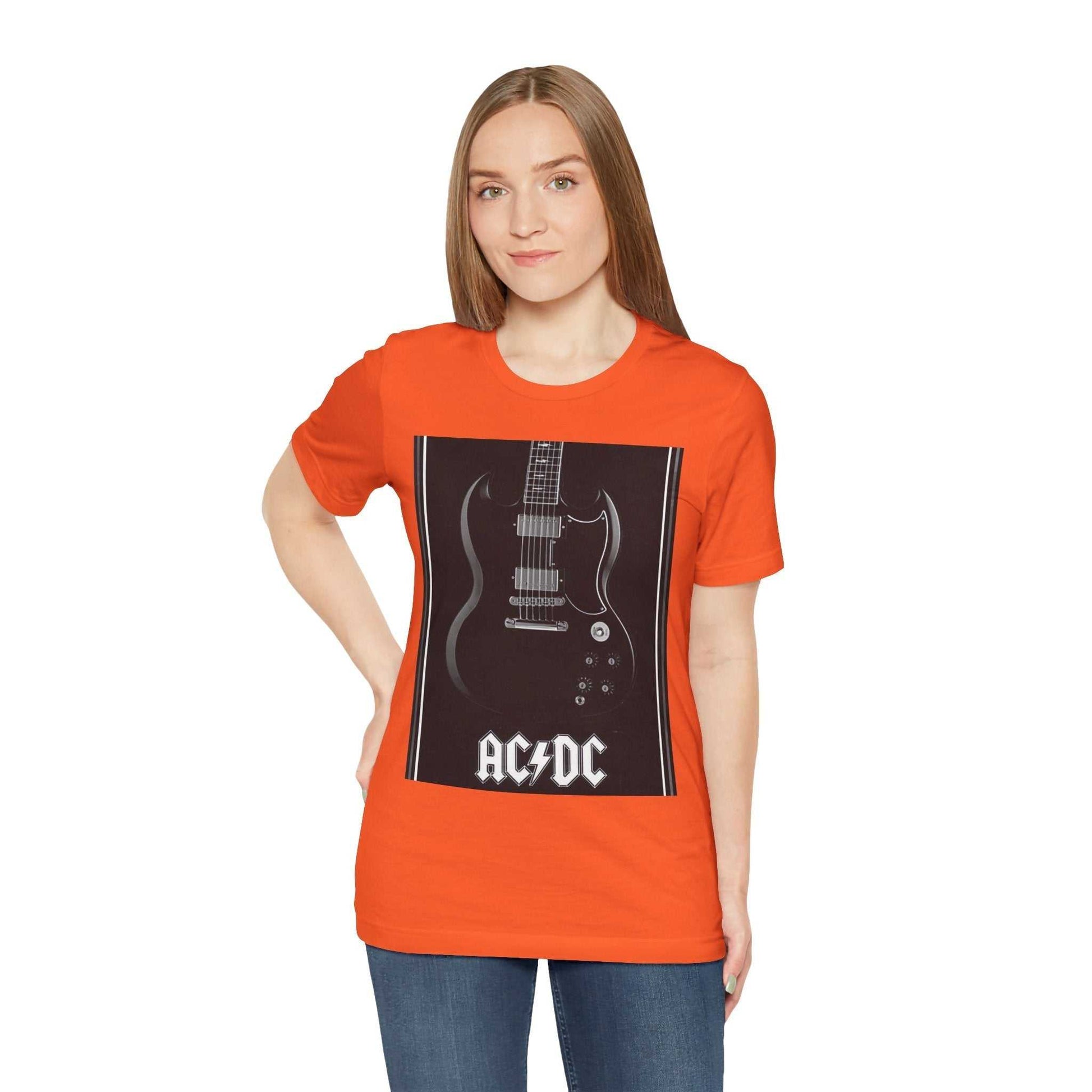 Woman wearing orange rock guitar graphic tee with AC/DC print on front