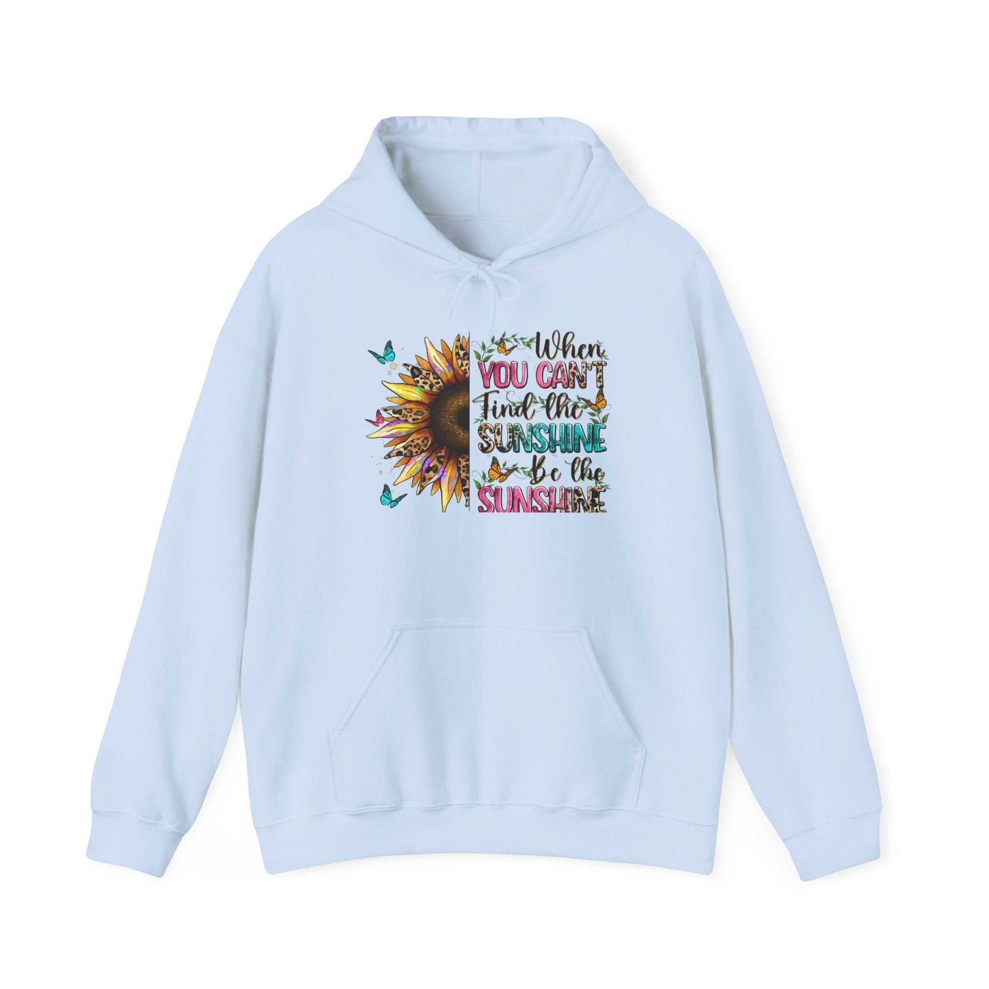 Light blue sunflower quote hoodie with "When you can't find the sunshine be the sunshine" inspirational text and butterfly accents