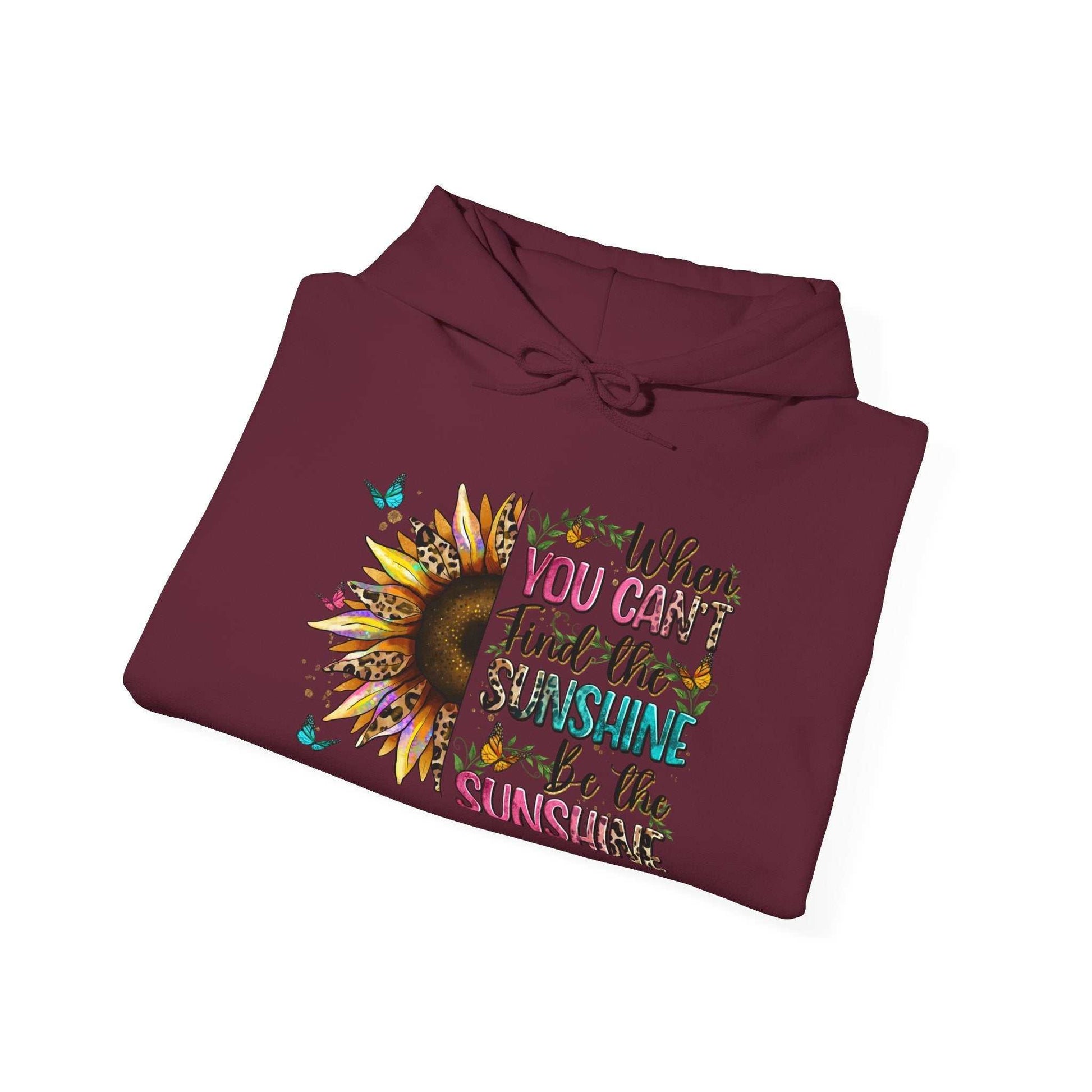 Folded maroon sunflower quote hoodie with colorful inspirational text and design