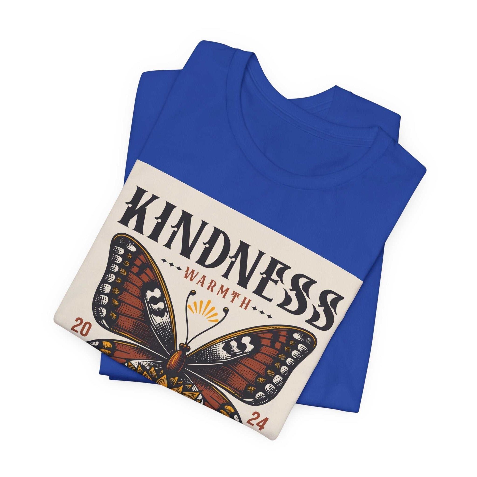 Folded blue Kindness Butterfly Tee with butterfly graphic and "Kindness Warmth 2024" text on front