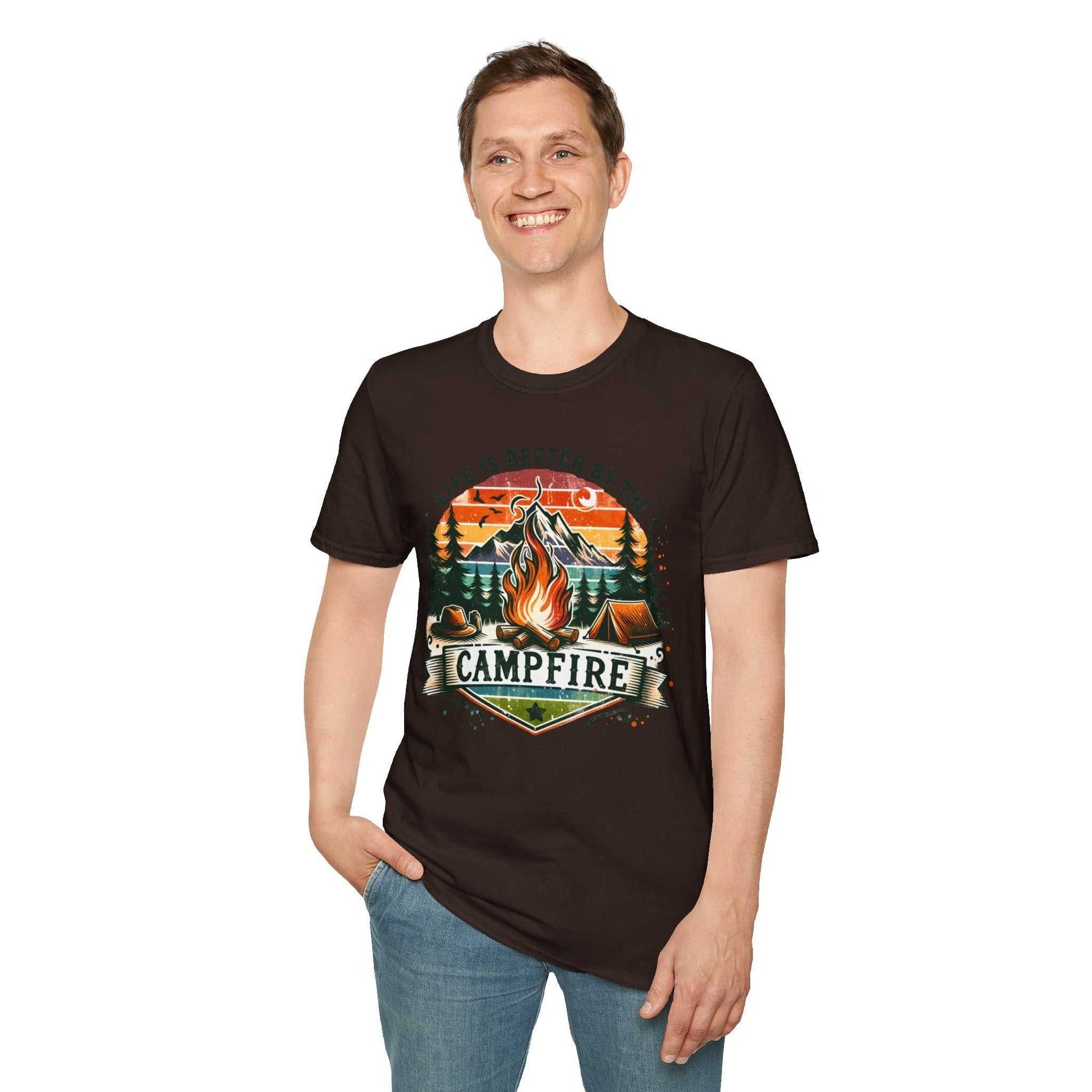 Man wearing black Camping Adventure Unisex T-Shirt with campfire graphic and "Life is Better by the Campfire" text