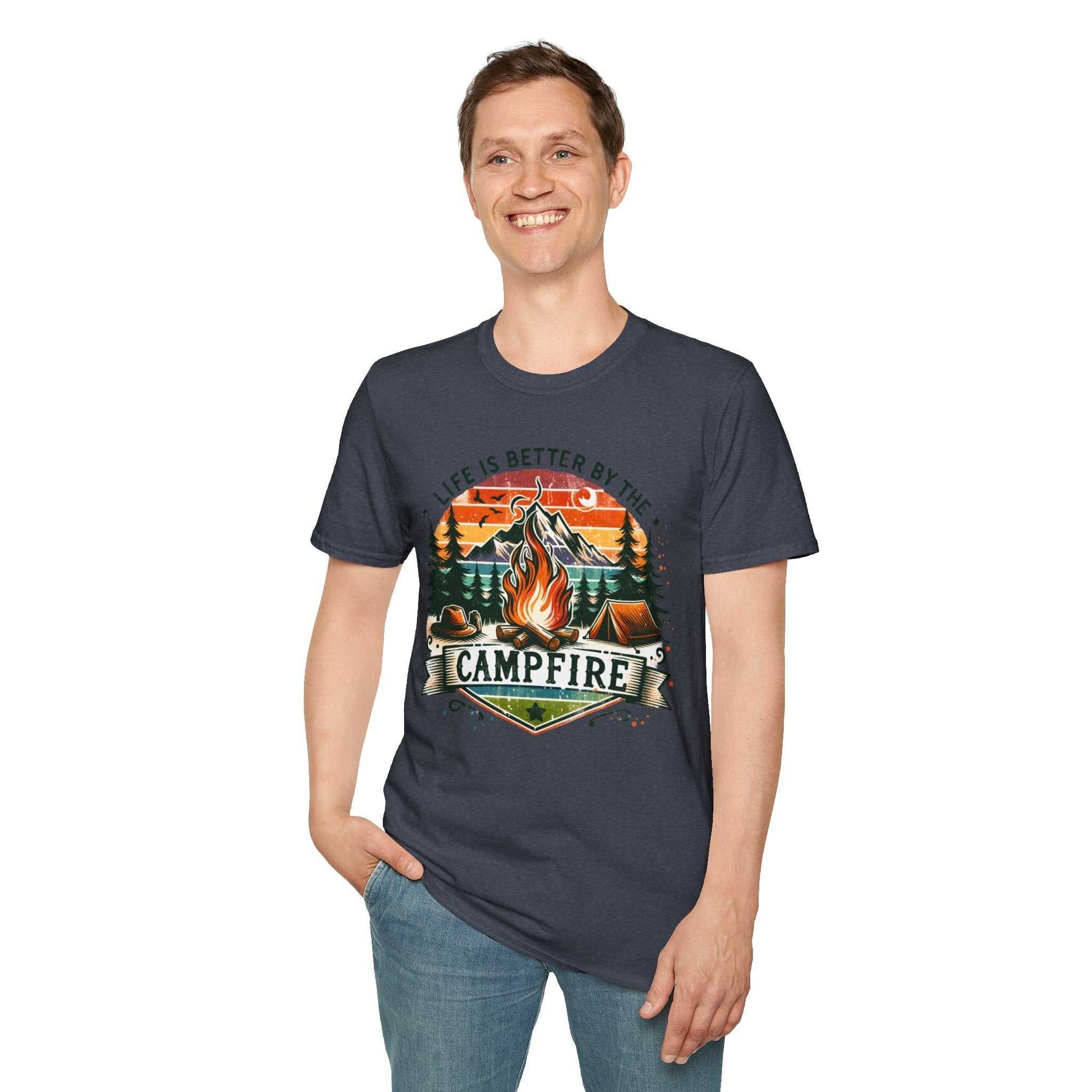 Camping Adventure Unisex T-Shirt with vibrant campfire design and "Life is Better by the Campfire" text worn by smiling man