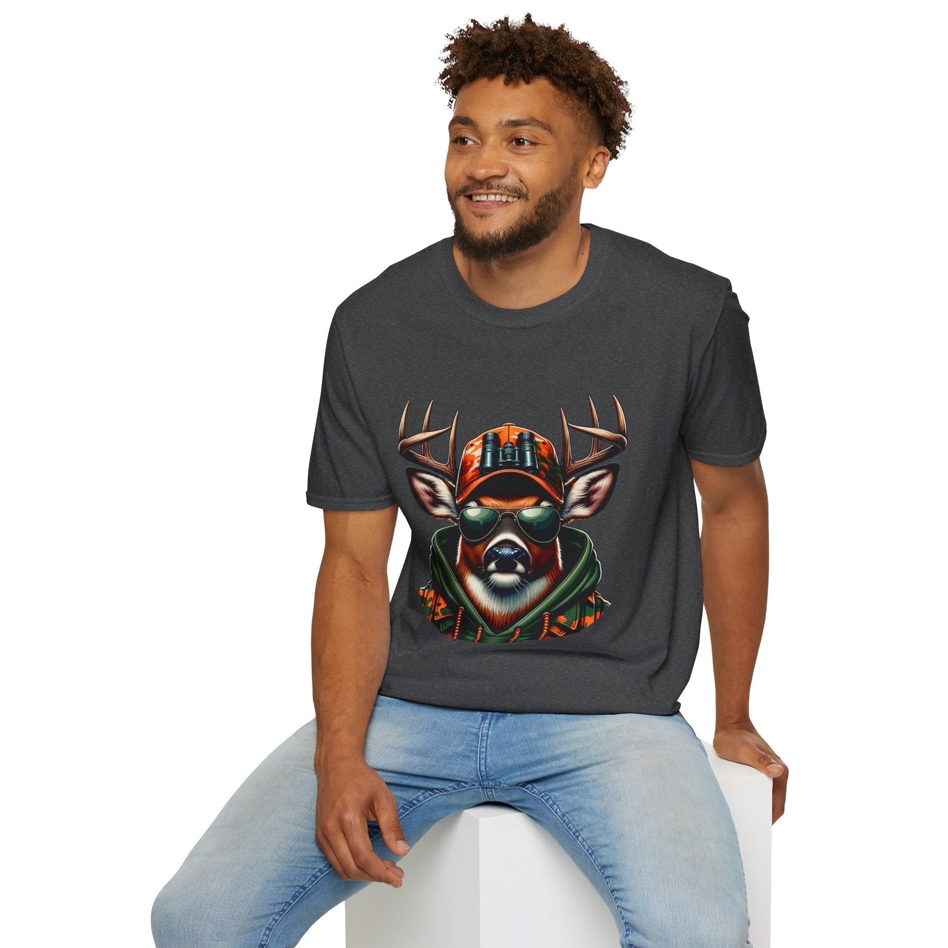 Man wearing charcoal hunting enthusiast t-shirt featuring a cool deer with sunglasses and camouflage hat design
