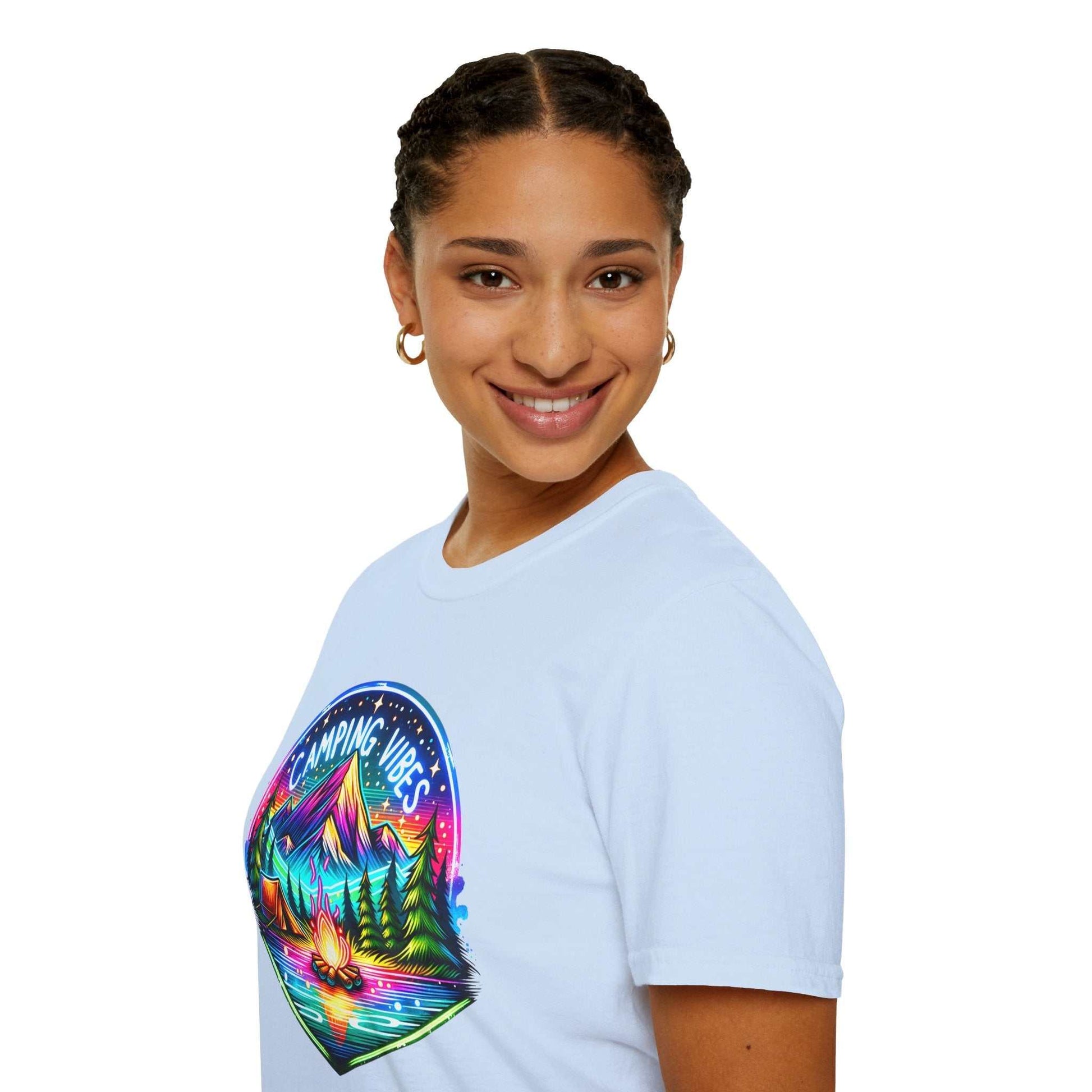 Woman wearing white Camping Vibes Unisex Softstyle T-Shirt with colorful outdoor mountain and campfire design