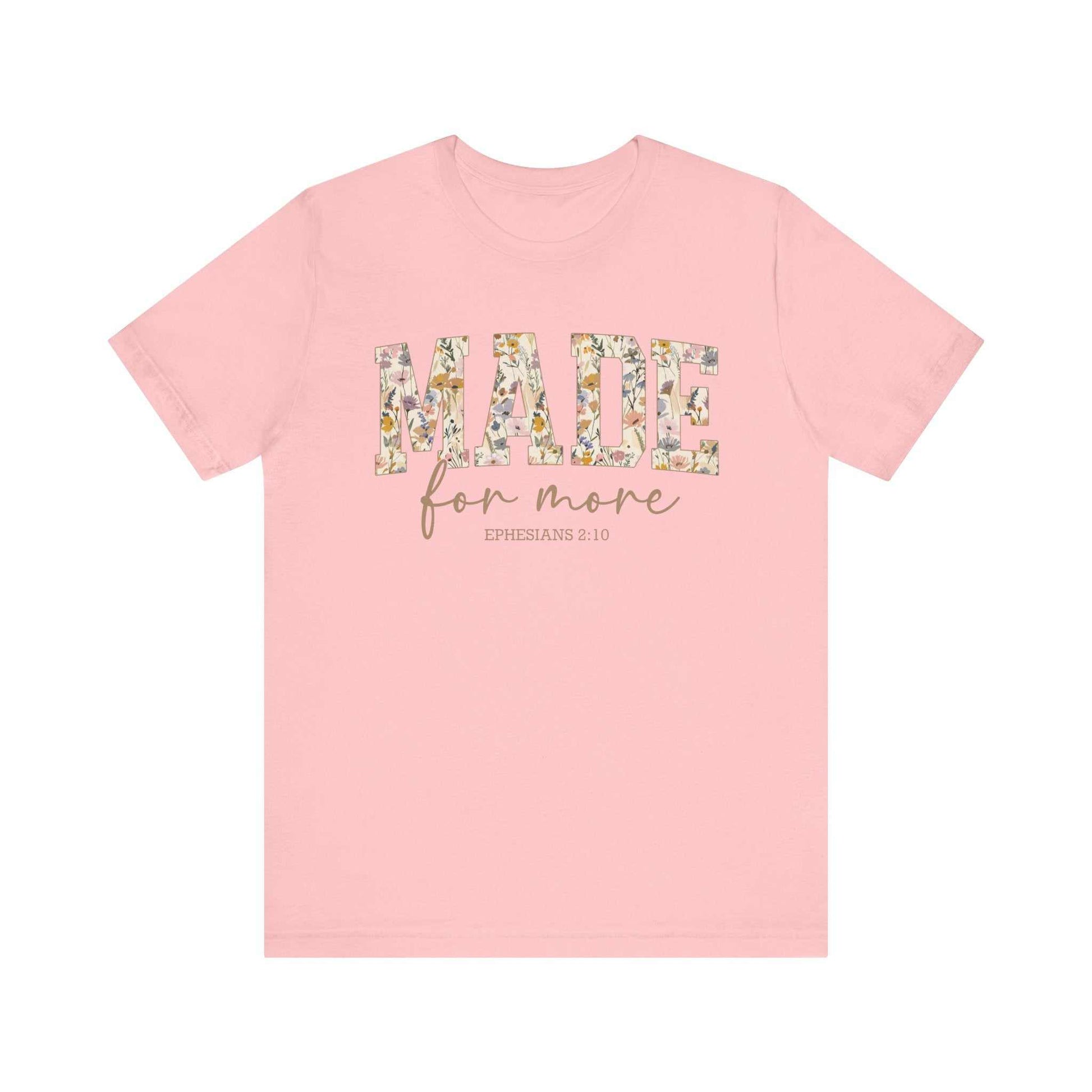 Pink unisex short sleeve tee with "MADE for more EPHESIANS 2:10" floral text design on front