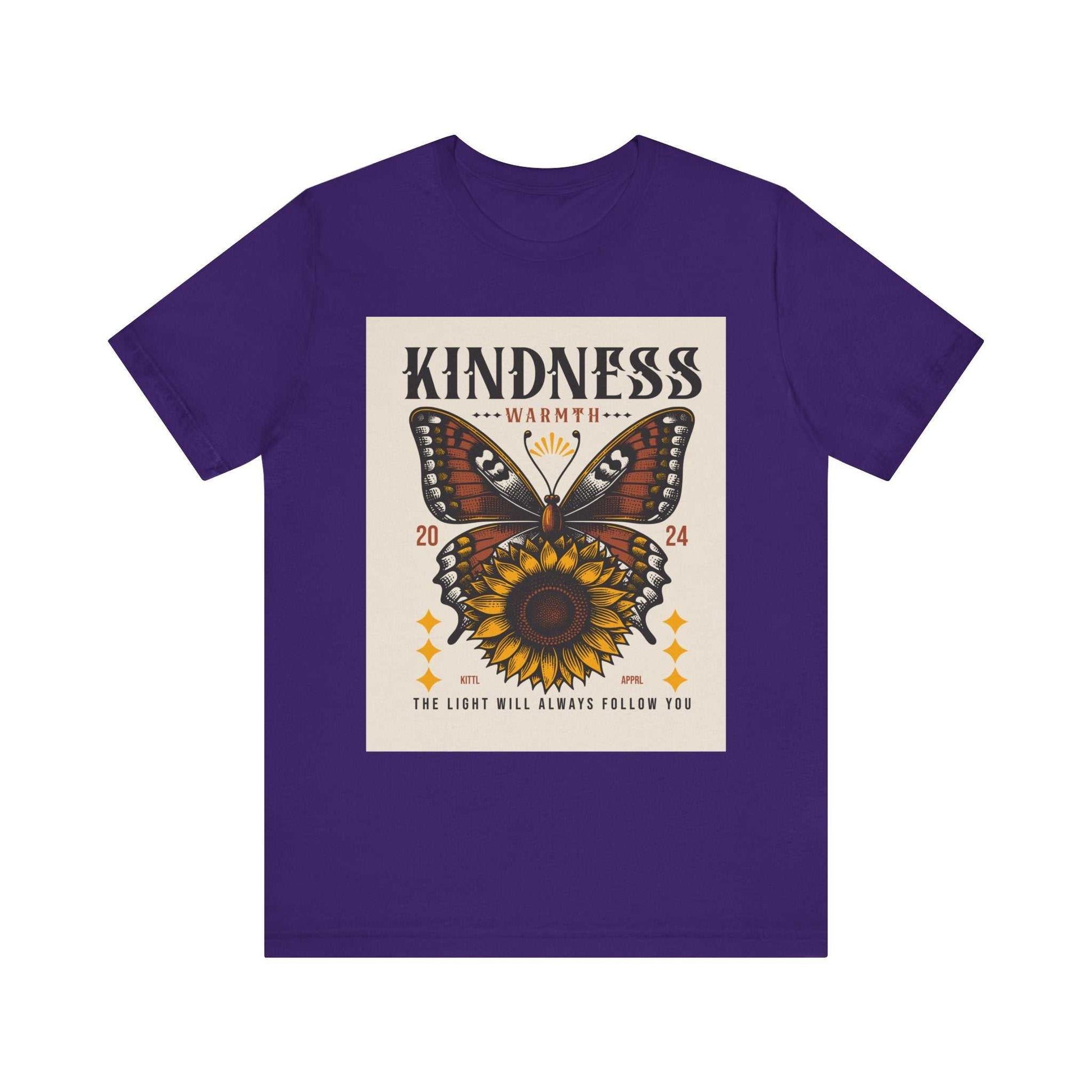 Purple unisex t-shirt featuring a butterfly and sunflower design with the text "Kindness Warmth 2024" and "The light will always follow you" on the front.