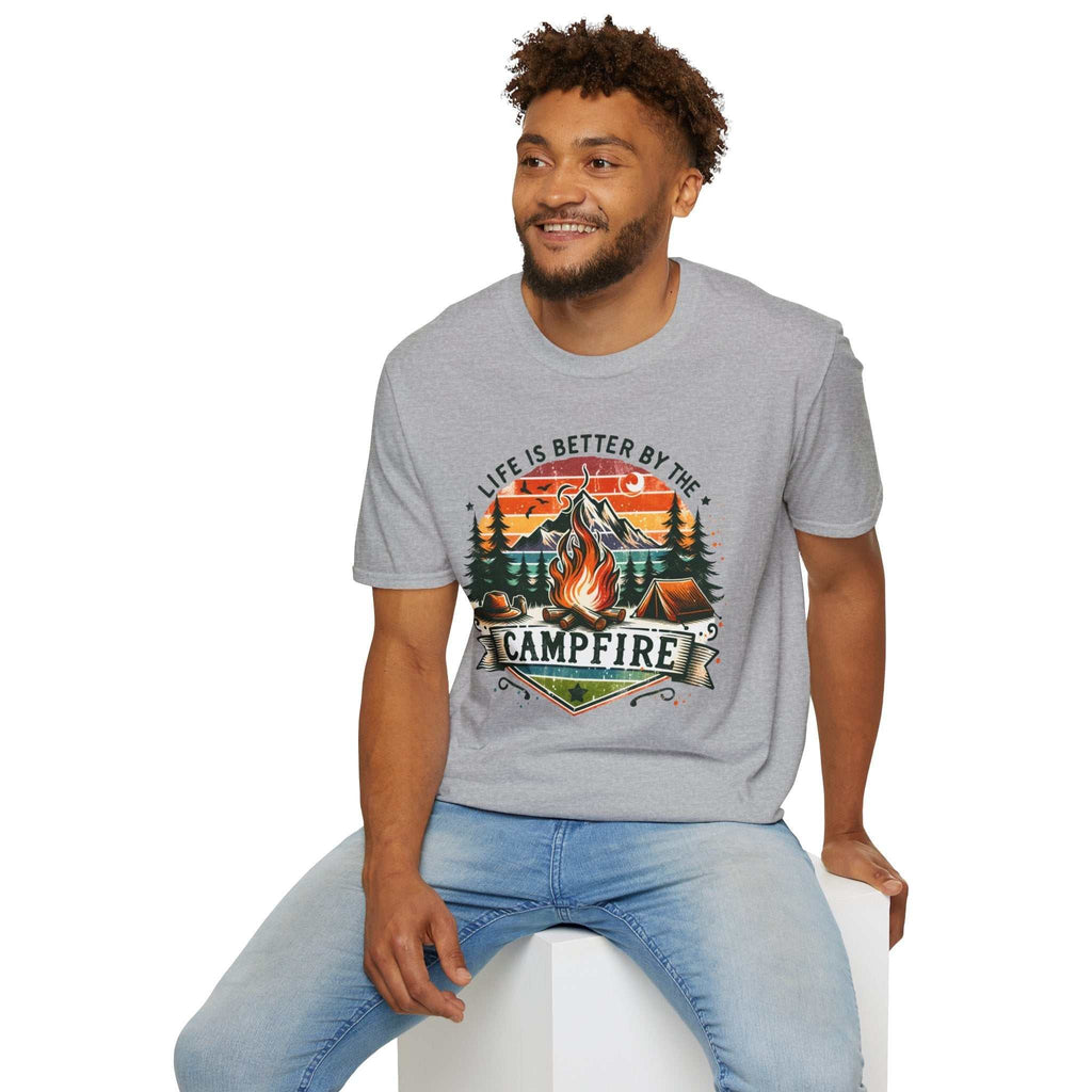 Unisex grey t-shirt with colorful campfire design and "Life is better by the campfire" text, worn by smiling man