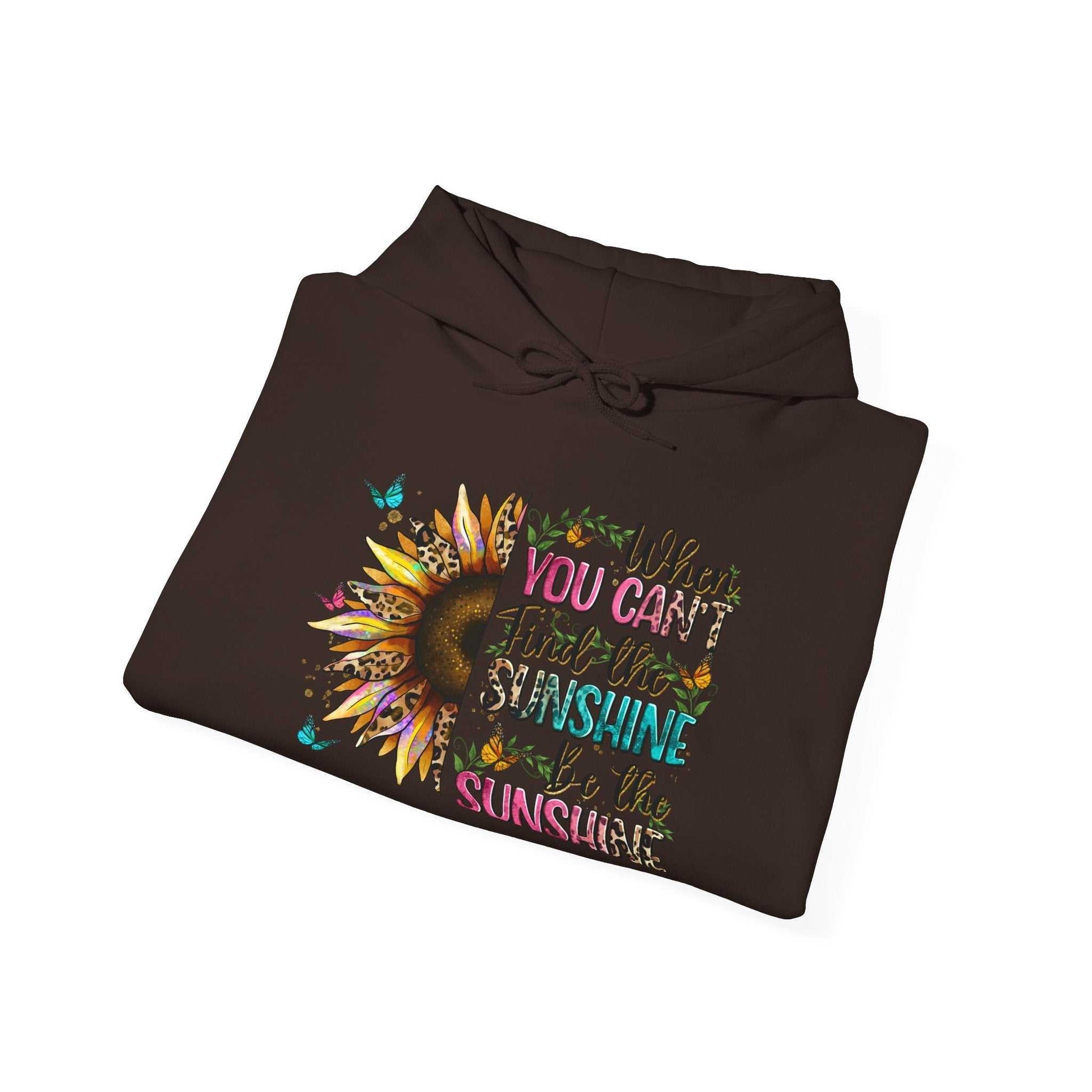 Folded brown sunflower quote hoodie with colorful inspirational text and sunflower design on front