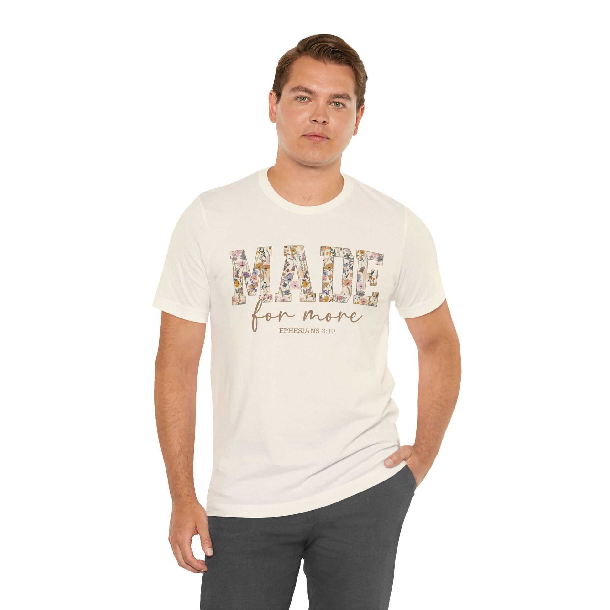 Man wearing white Made for More Tee with floral text design and slim fit