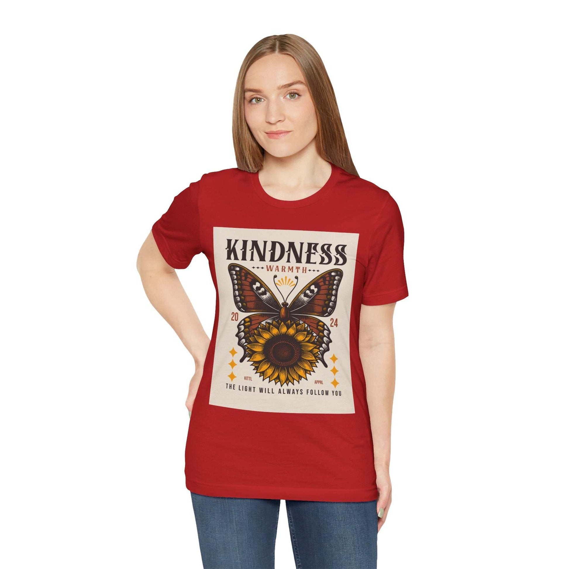 Woman wearing red Kindness Butterfly Tee with butterfly and sunflower graphic and inspirational text