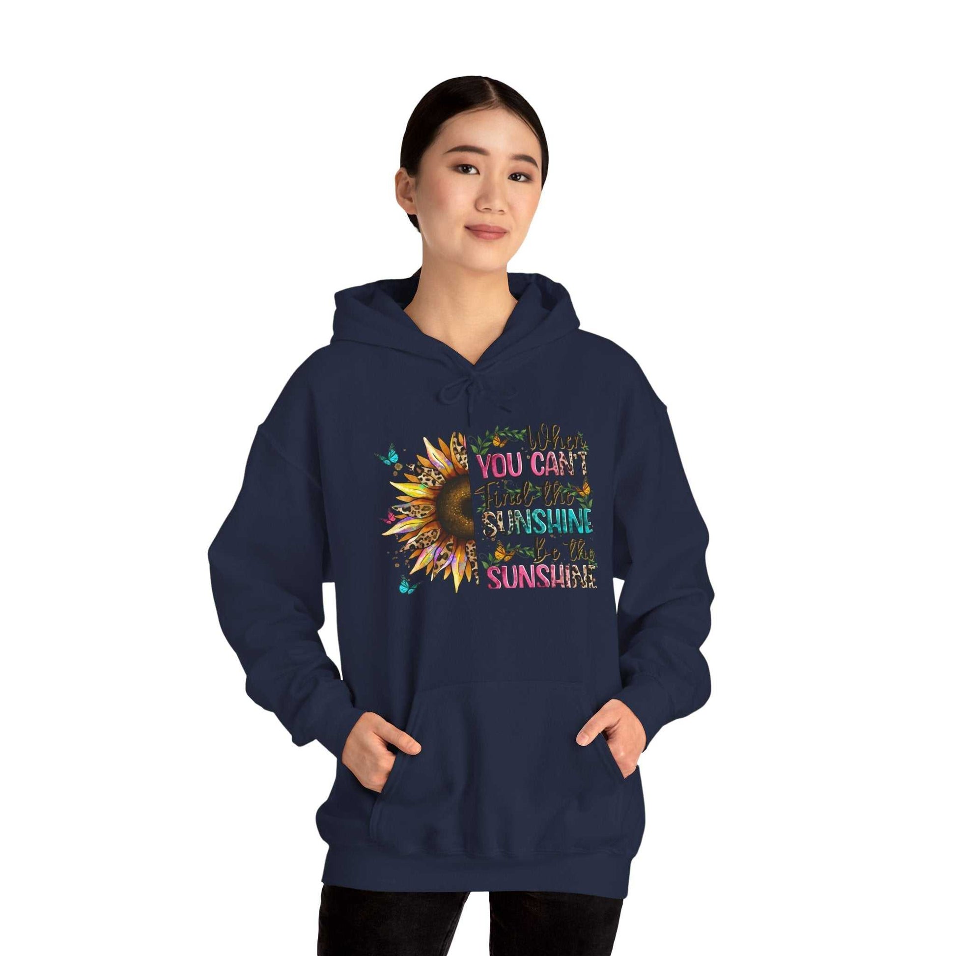 woman wearing navy blue sunflower quote hoodie with inspirational colorful text and sunflower graphic design