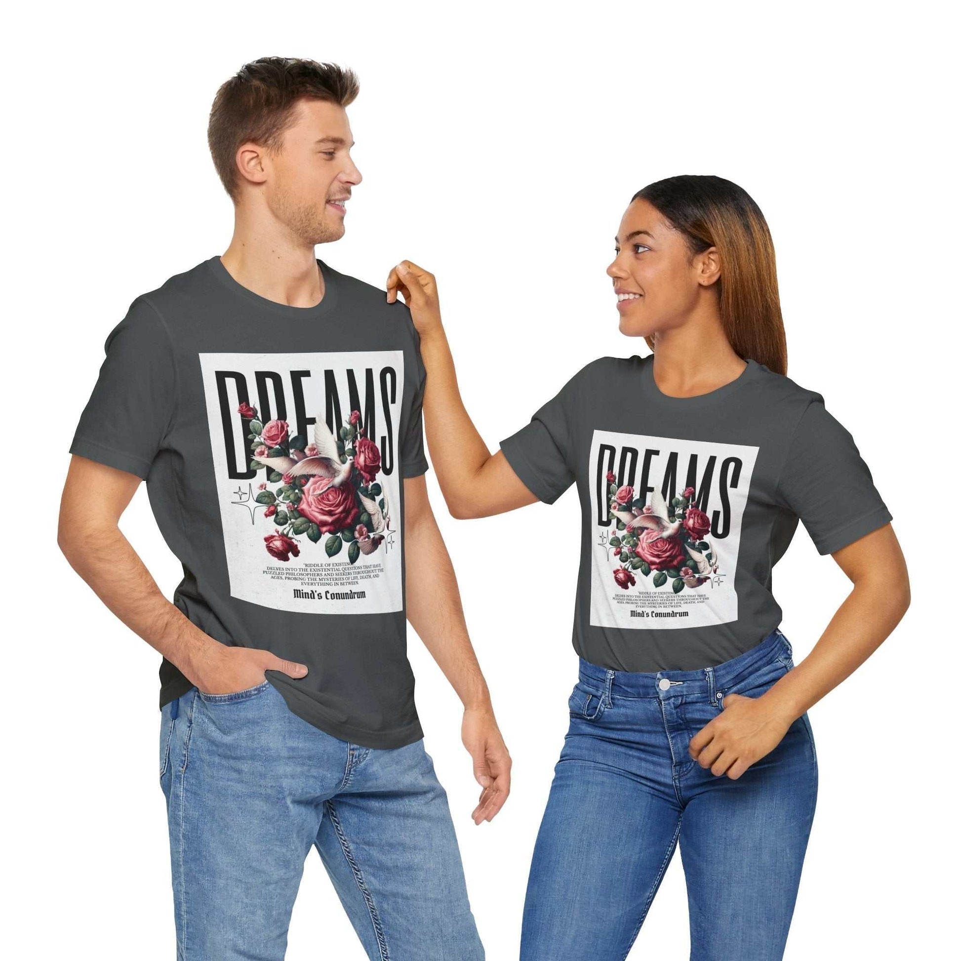 Two models wearing black dreams floral tee with pink roses and typography design on front, paired with jeans.