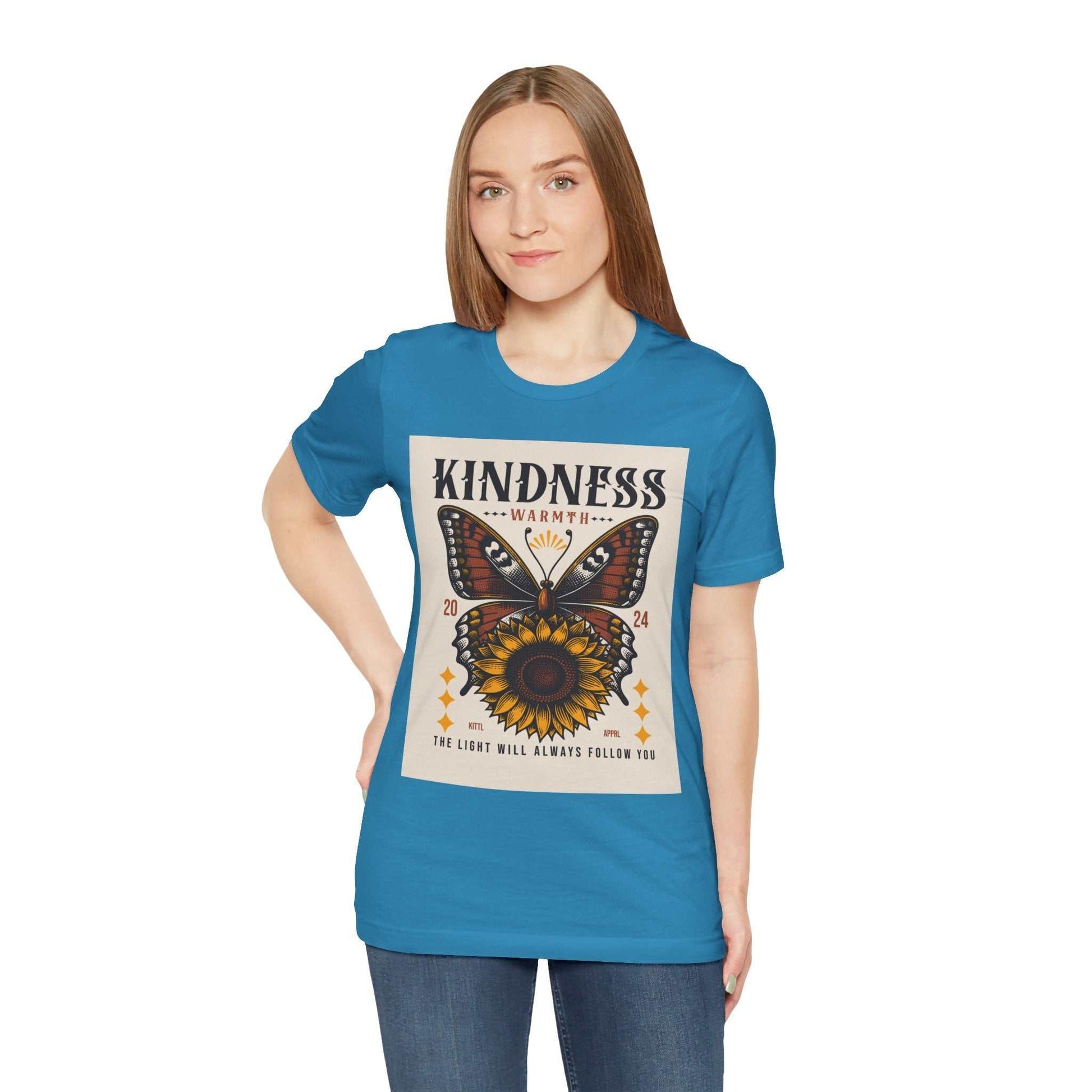 Woman wearing blue Kindness Butterfly Tee with butterfly and sunflower design and positive message