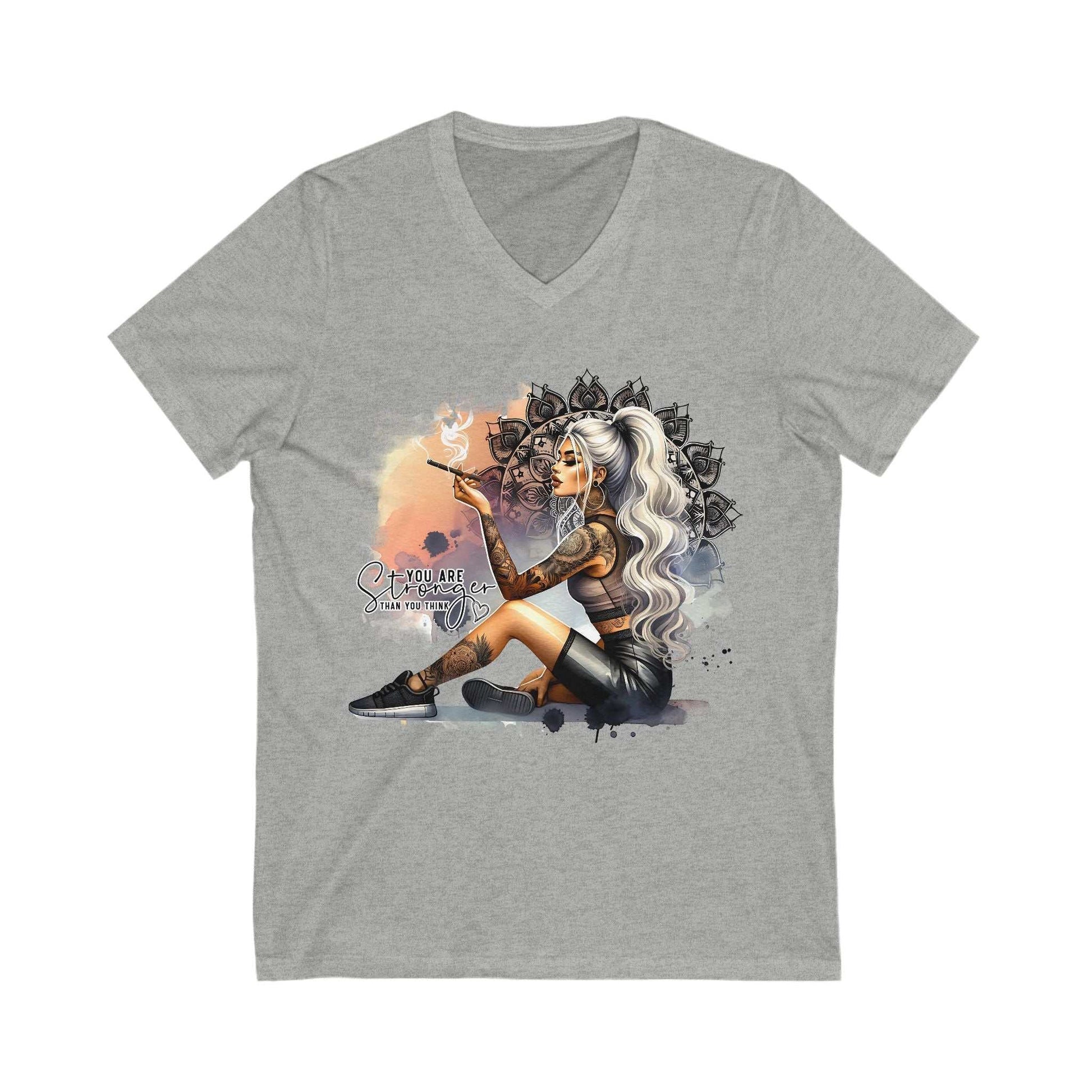 Gray V-neck T-shirt with "YOU ARE STRONGER" graphic featuring a seated woman with tattoos and white hair smoking, unisex casual cotton tee.